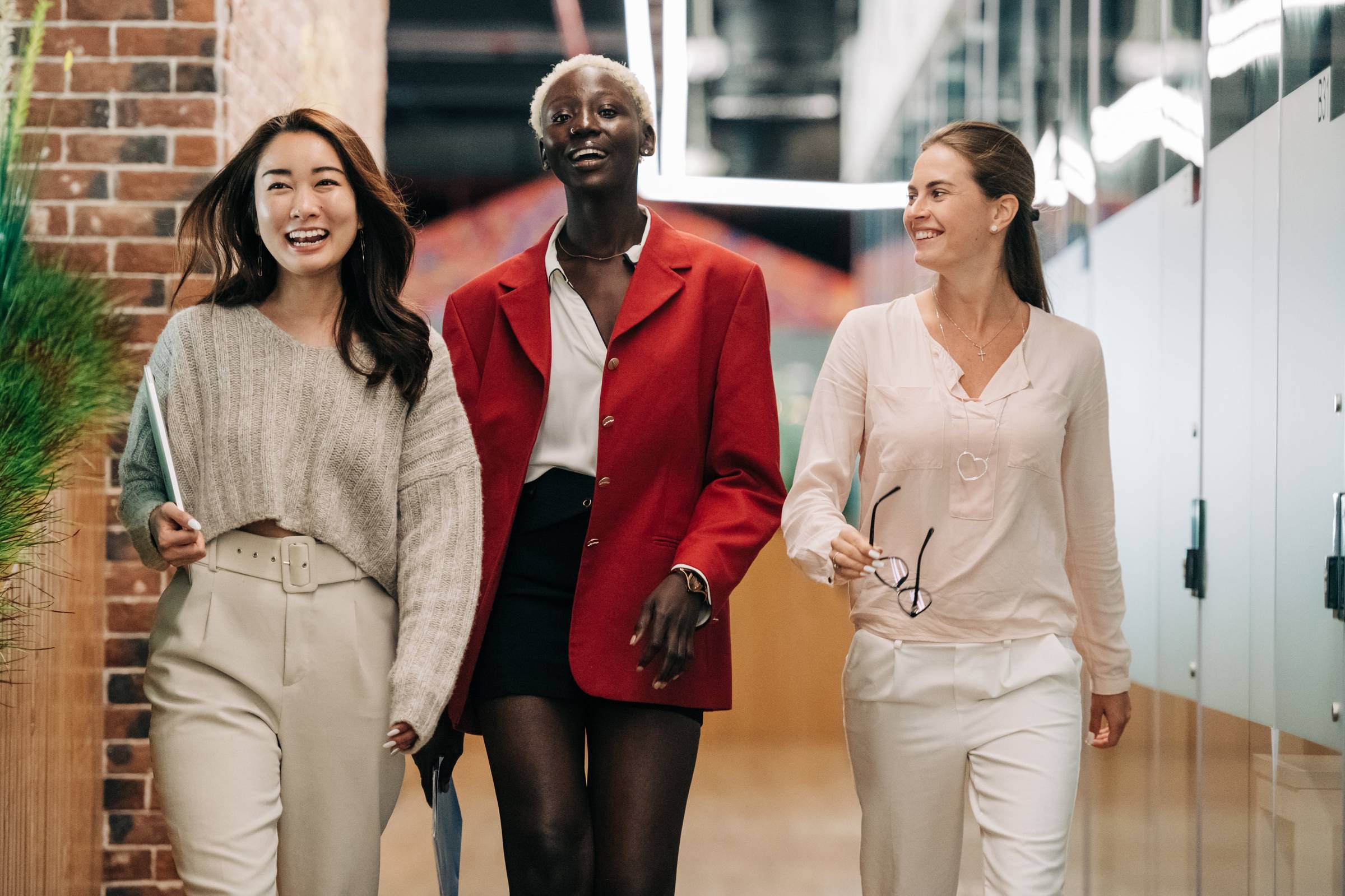 Three Women Walking and Laughing
