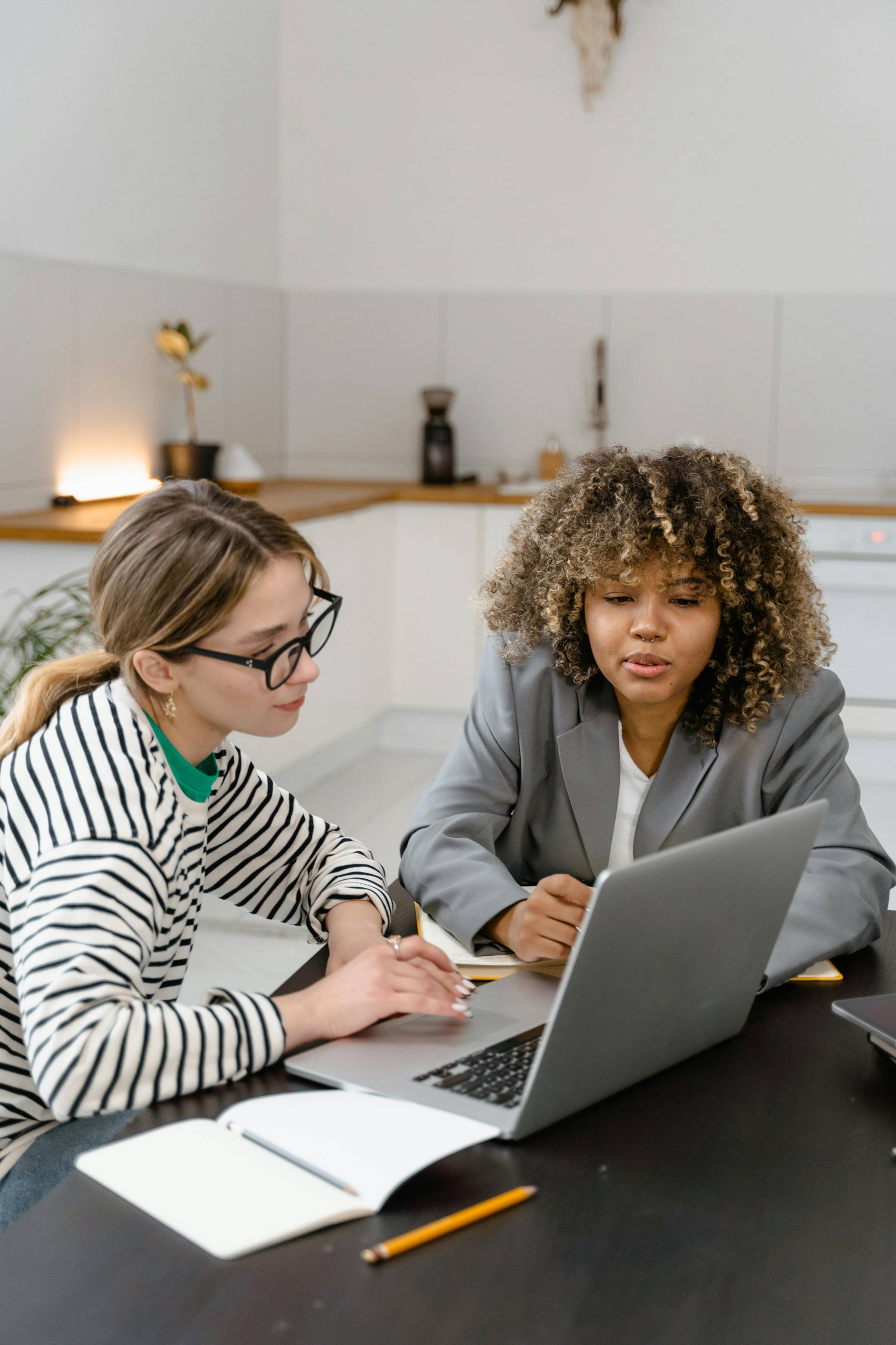 Two Women at Computer Talking