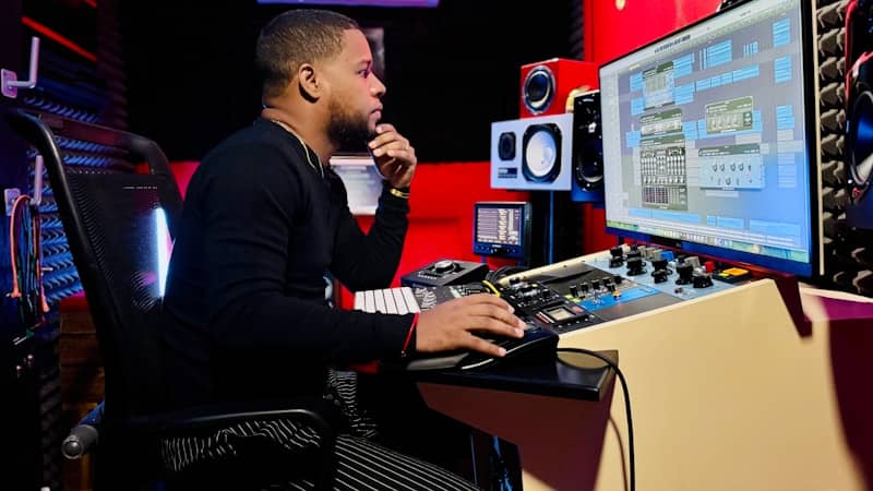 A man sitting at a desk in front of a computer
