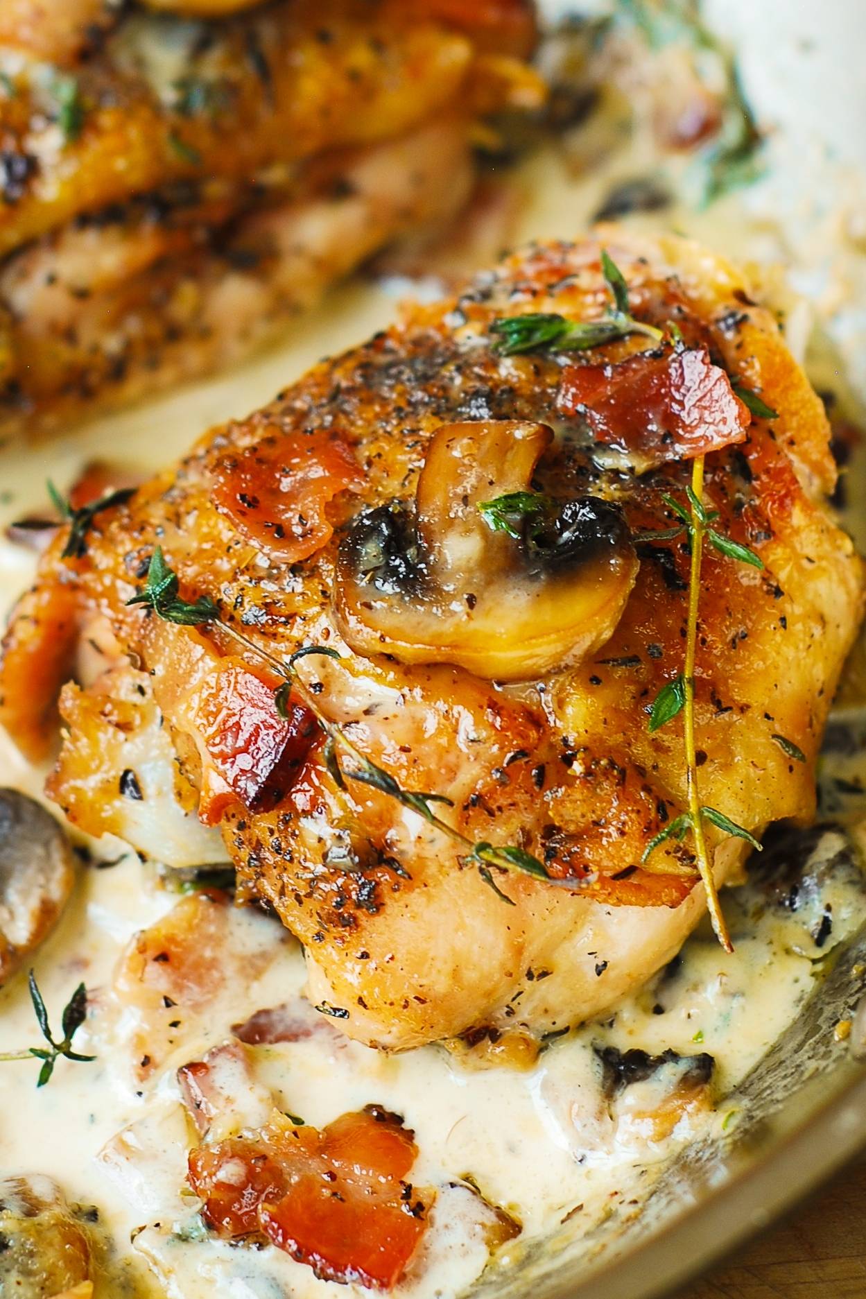 Chicken Thighs with Creamy Bacon Mushroom Thyme Sauce.