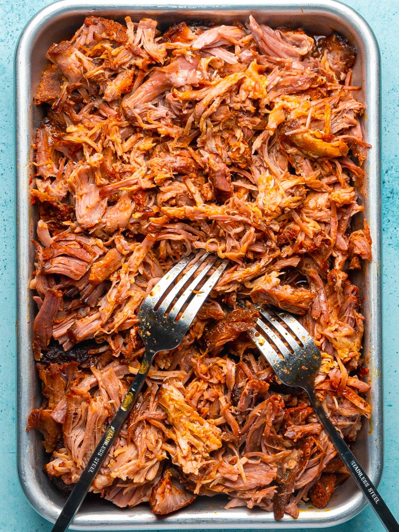 Slow Cooker Hawaiian Pulled Pork with Pineapple on a sheet pan.
