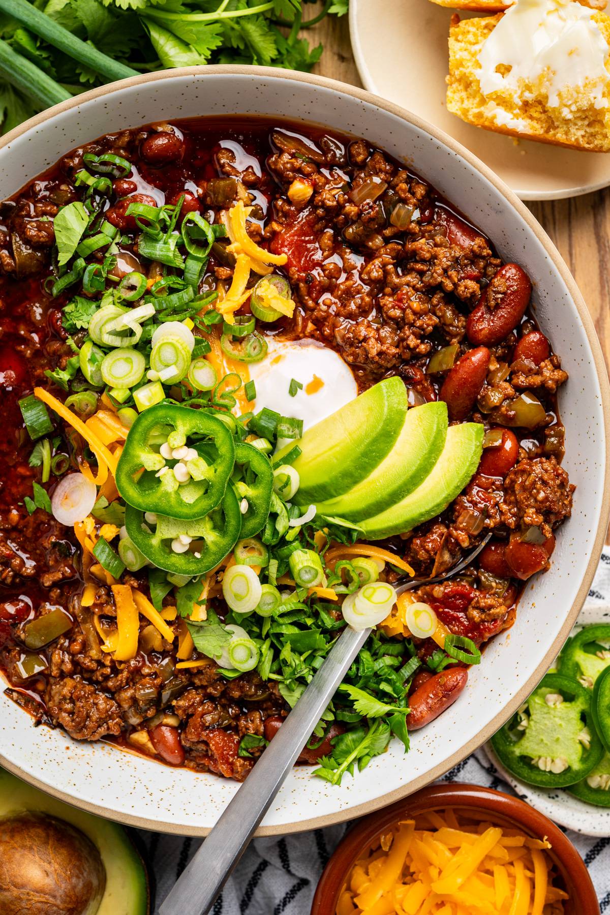 Classic chili with ground beef, beans, a three-pepper base (bell pepper, poblano, and jalapeño), and fire-roasted tomatoes.in a bowl.