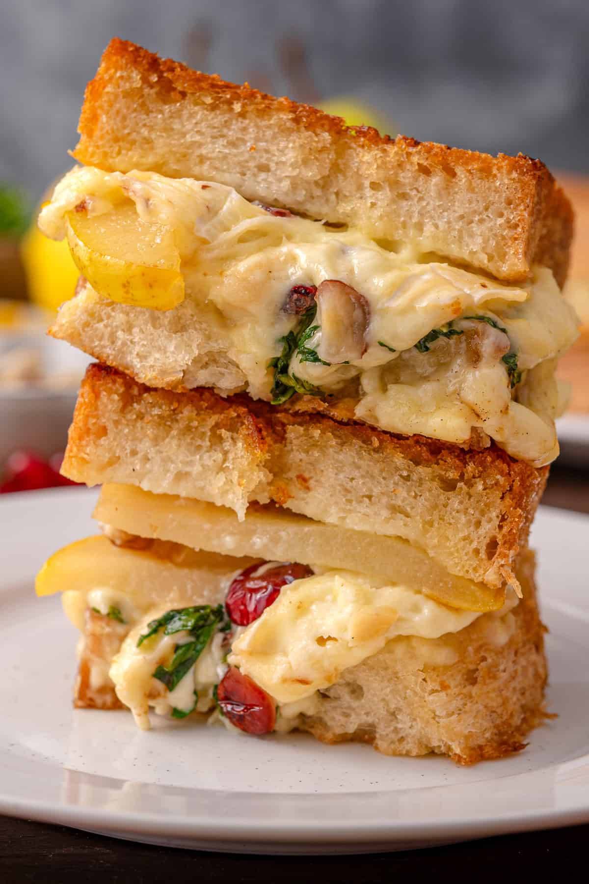 Sliced Pear & Brie Grilled Cheese Sandwich on a plate.