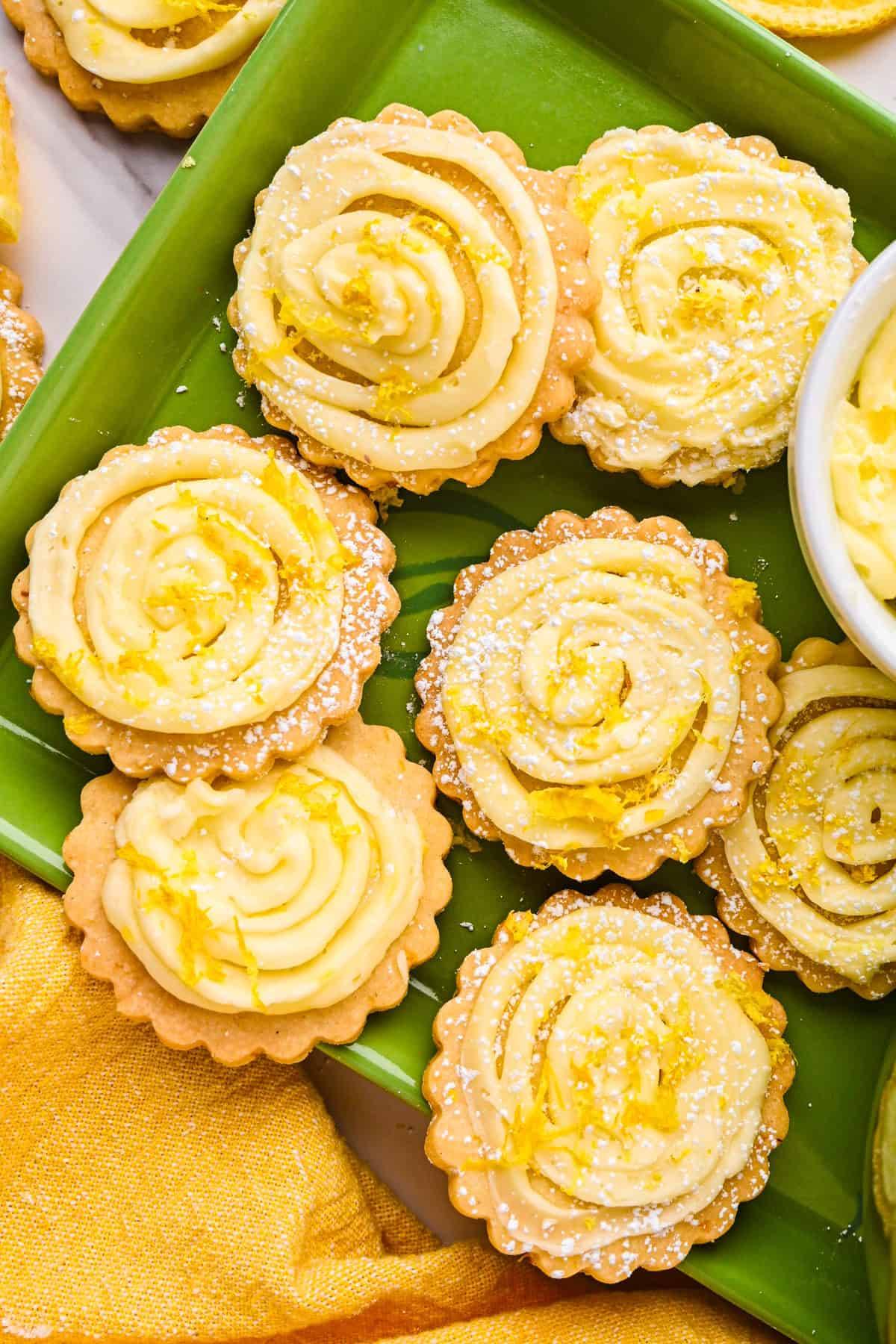 Classic lemon shortbread cookies on a green tray.