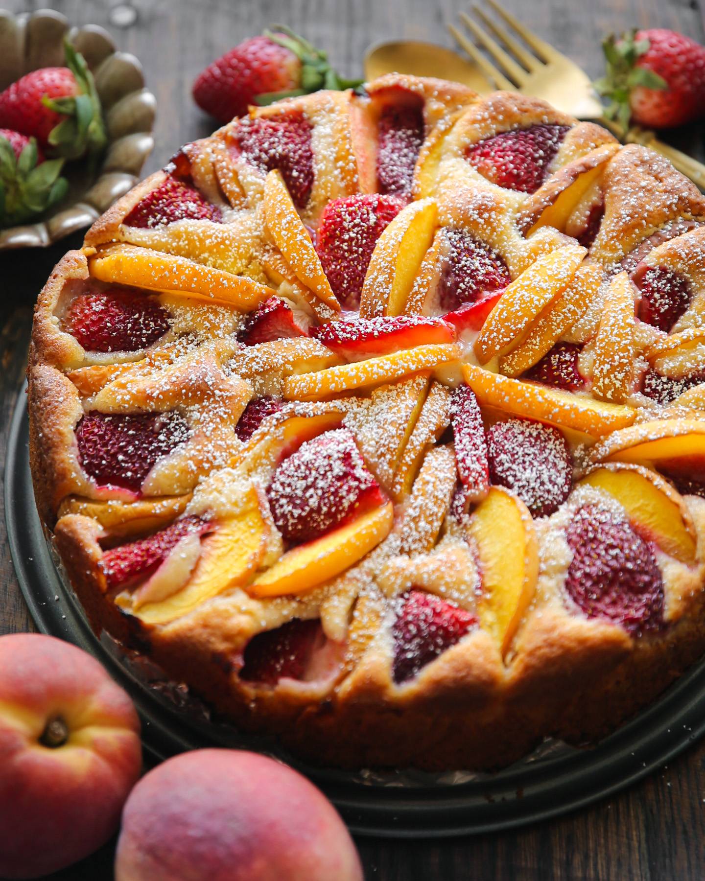 Strawberry Peach Cake on a dark background.