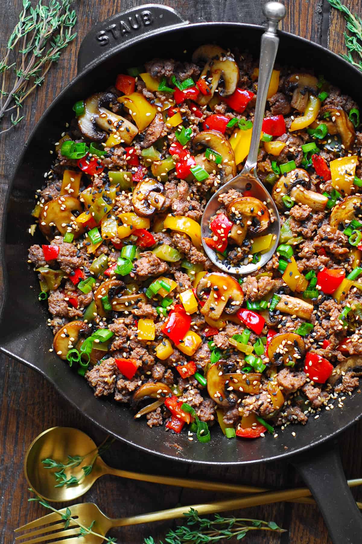 Ground Beef Stir Fry with Vegetables in a cast iron skillet.