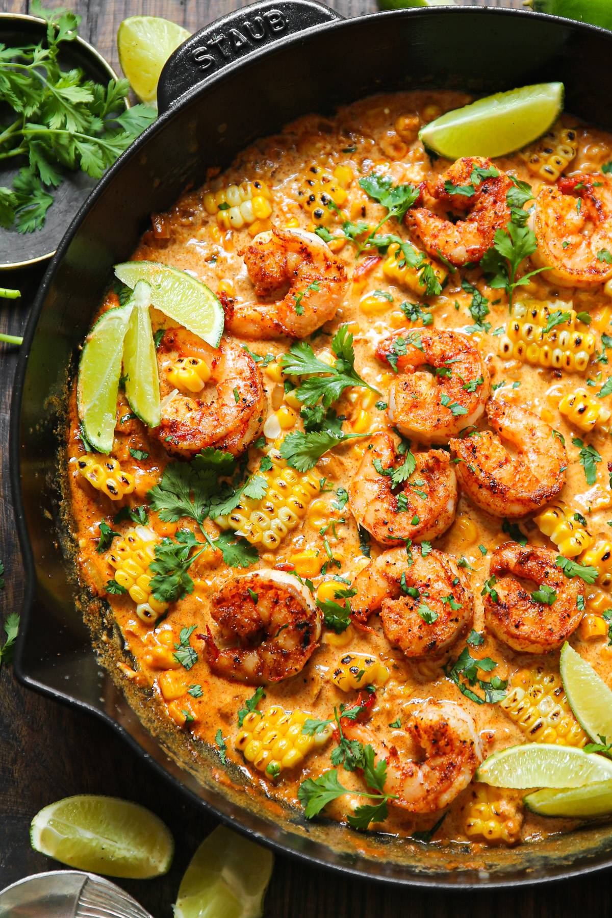 Shrimp and Creamed Corn in a cast iron skillet.
