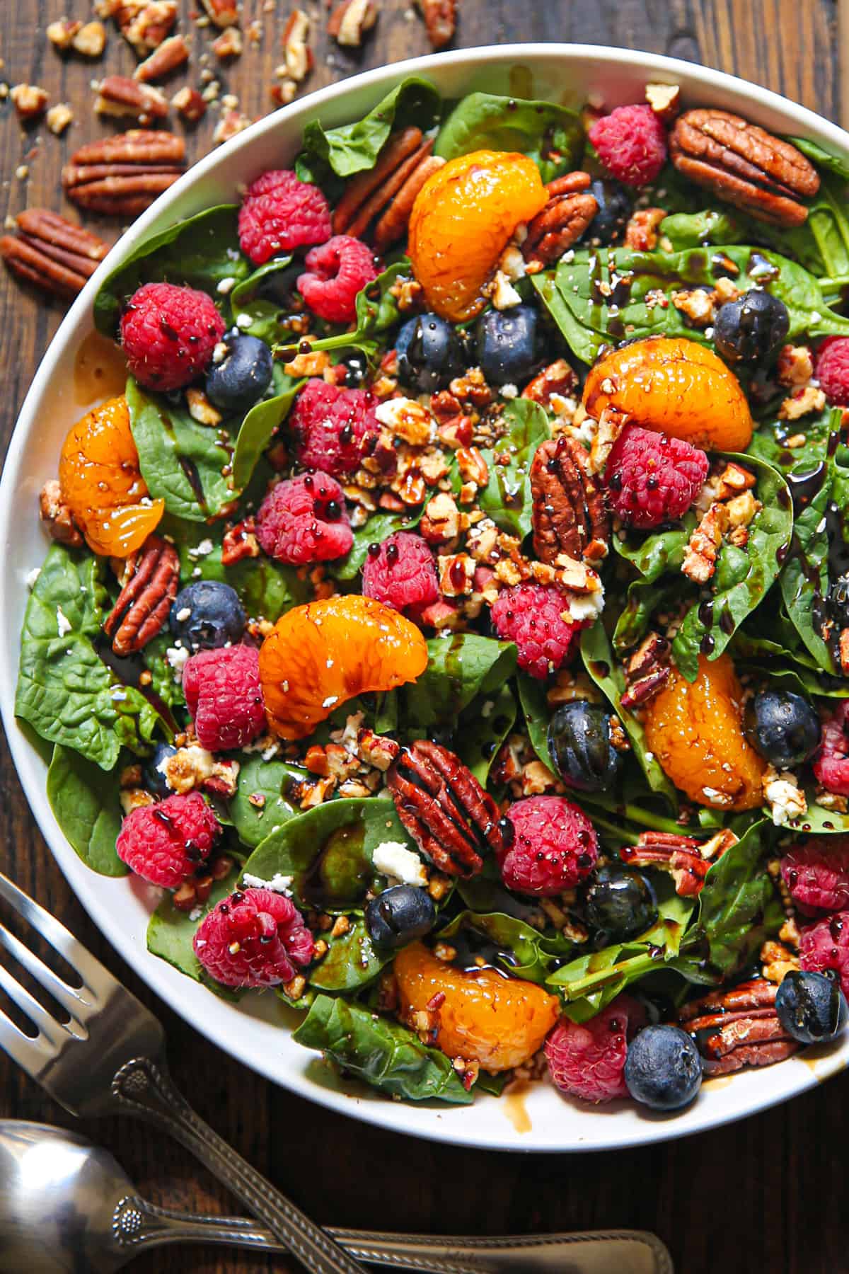 Berry Spinach Salad with Blueberries, Raspberries, and Balsamic Dressing in a bowl.