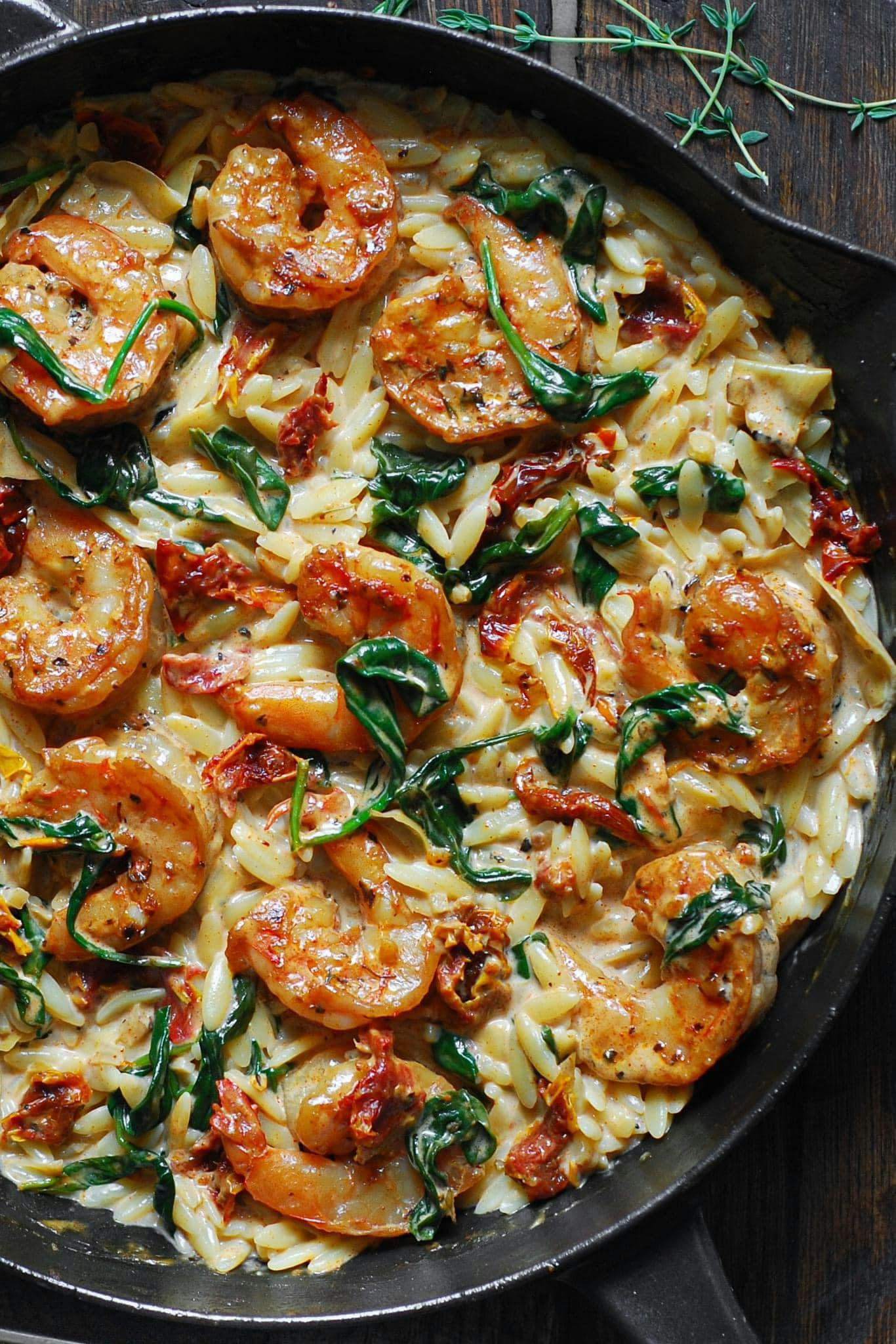 Creamy Tuscan Shrimp Orzo with Spinach, Artichokes, and Sun-Dried Tomatoes