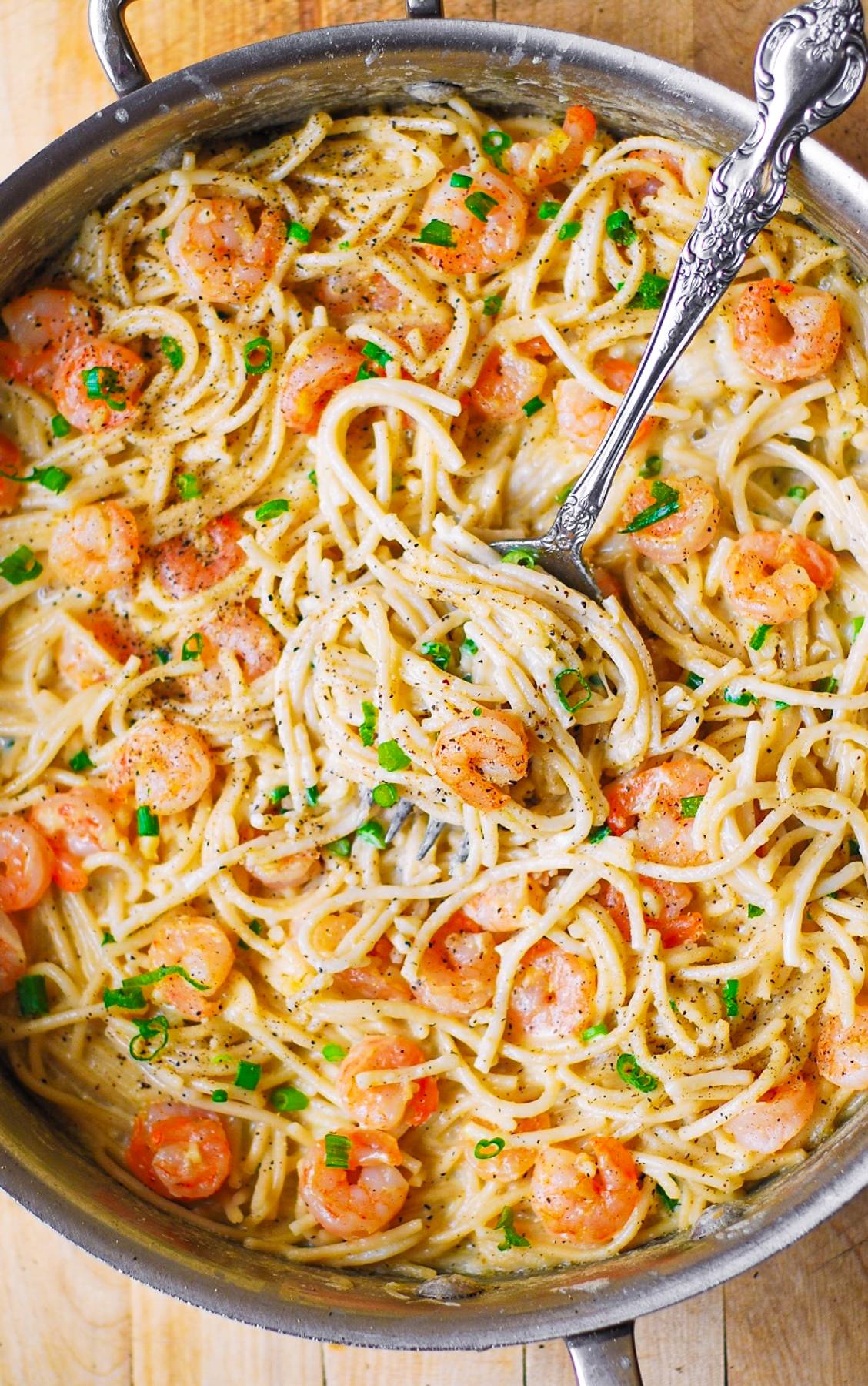 Garlic Shrimp Alfredo in a Creamy Four Cheese Pasta Sauce - in a stainless steel pan.