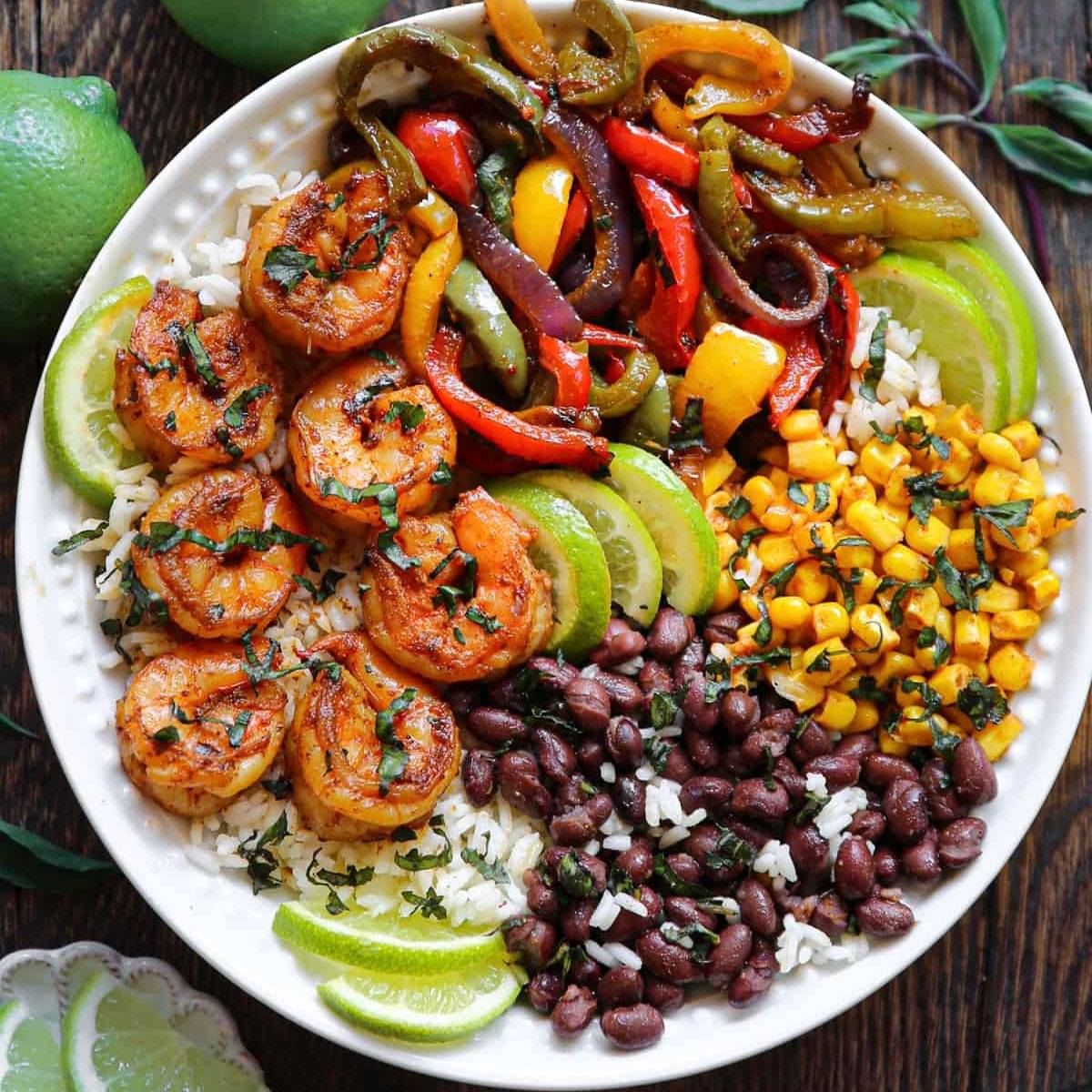 Shrimp Fajita Bowls with roasted bell peppers, rice, black beans, and corn.
