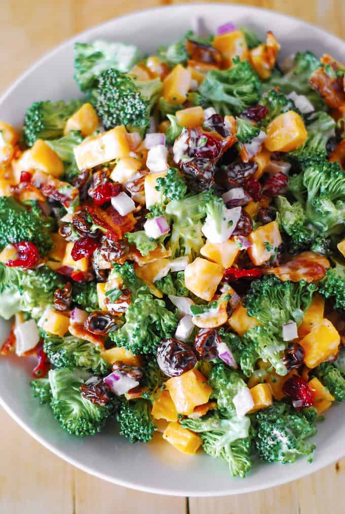 Creamy Broccoli Bacon Salad with Raisins and Cheddar Cheese on a plate.