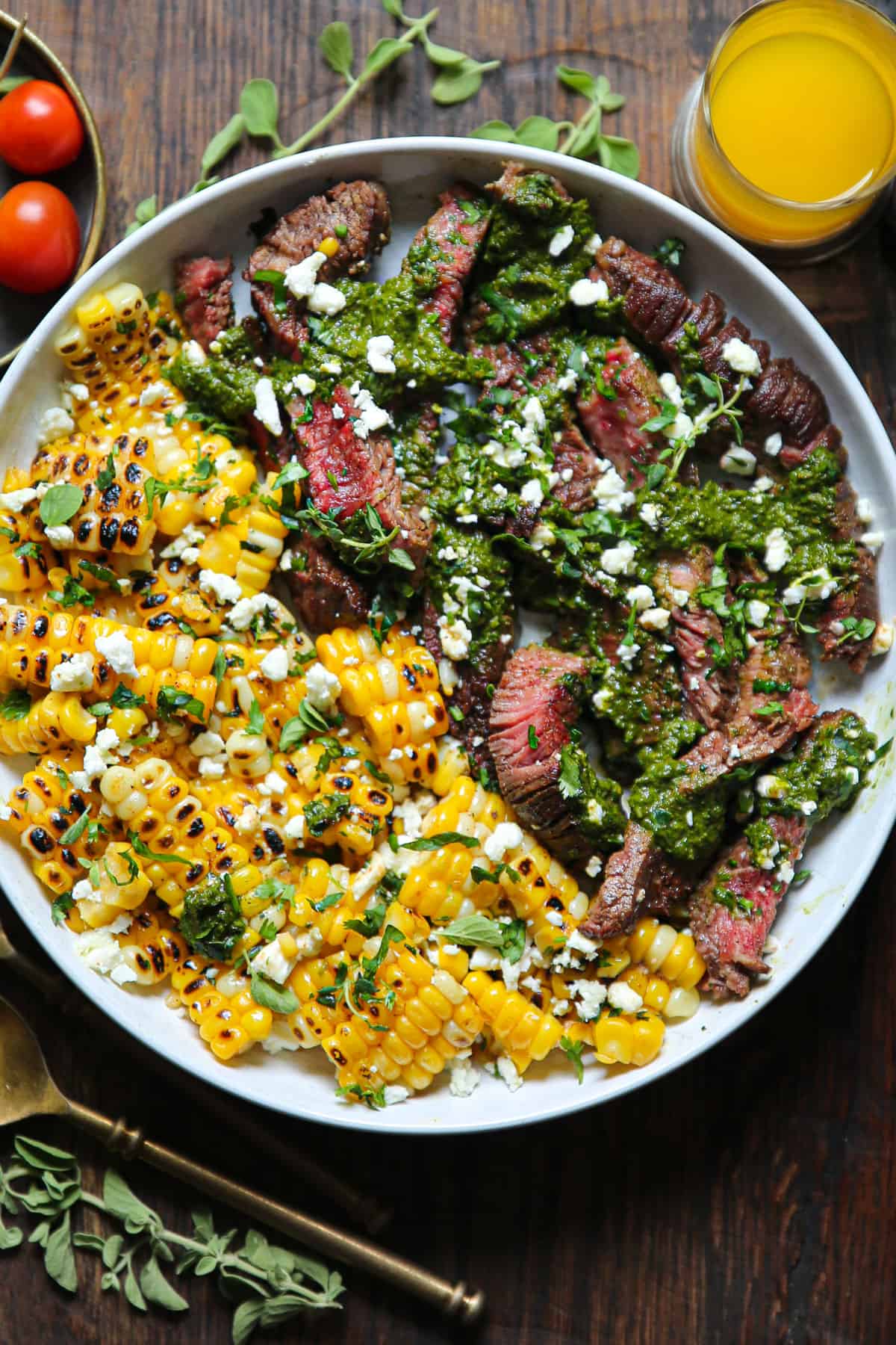 Pan-Seared Steak with Corn, Feta, and Spinach Sauce.