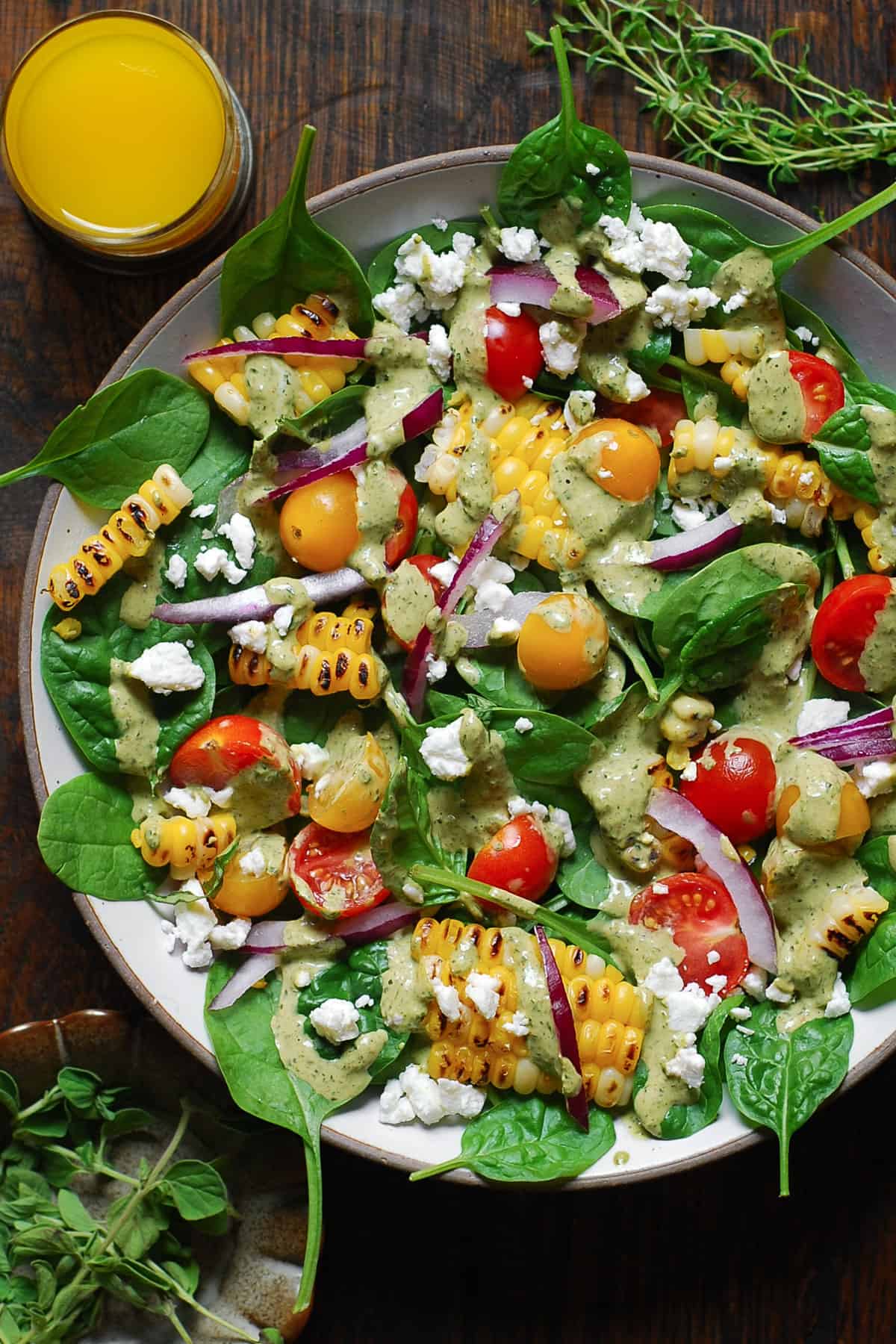 Corn, Tomato, and Spinach Salad with Creamy Pesto Dressing.