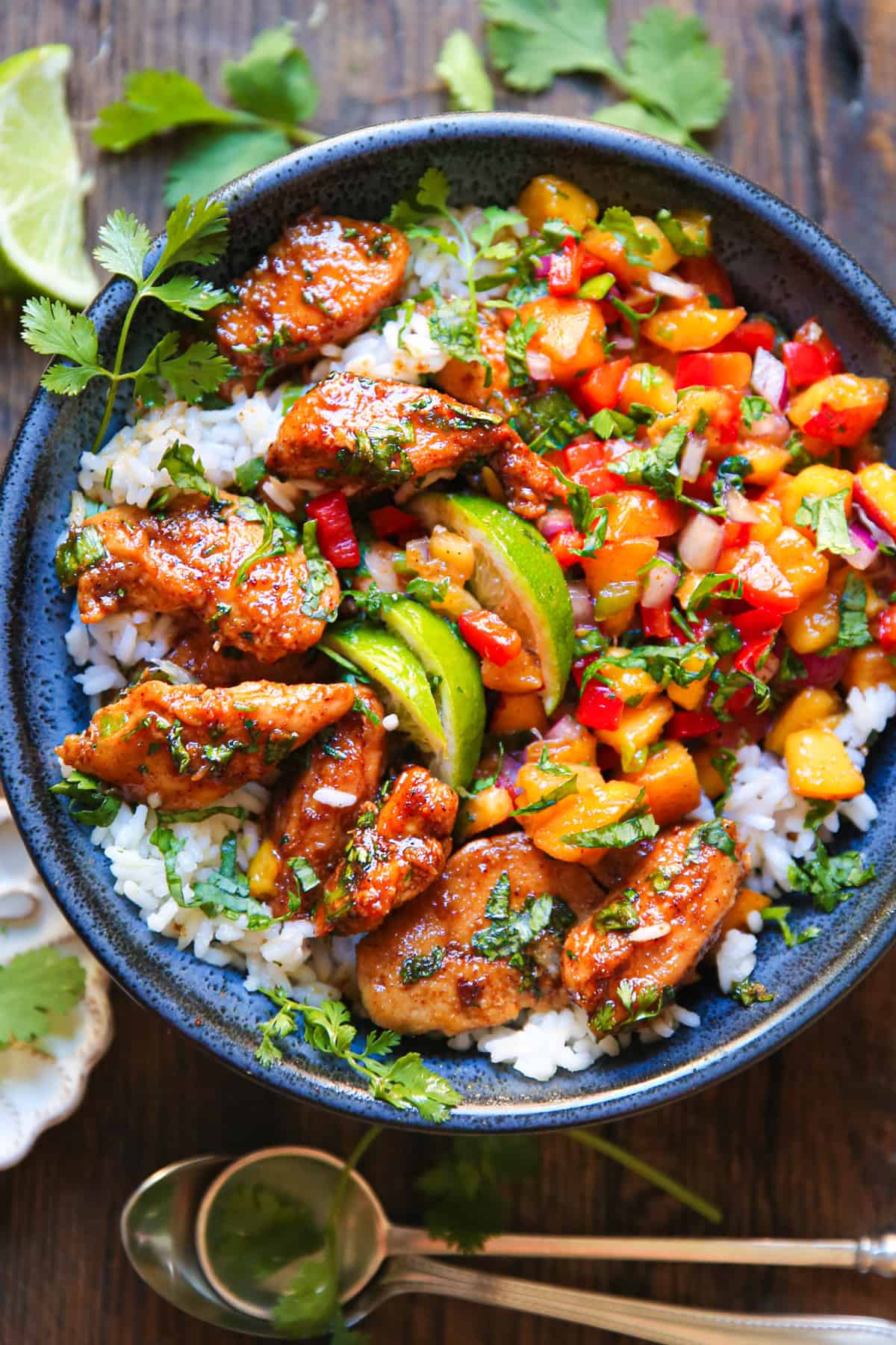 Cilantro-Lime Chicken Bowls with Peach Salsa and Rice - in a blue bowl.