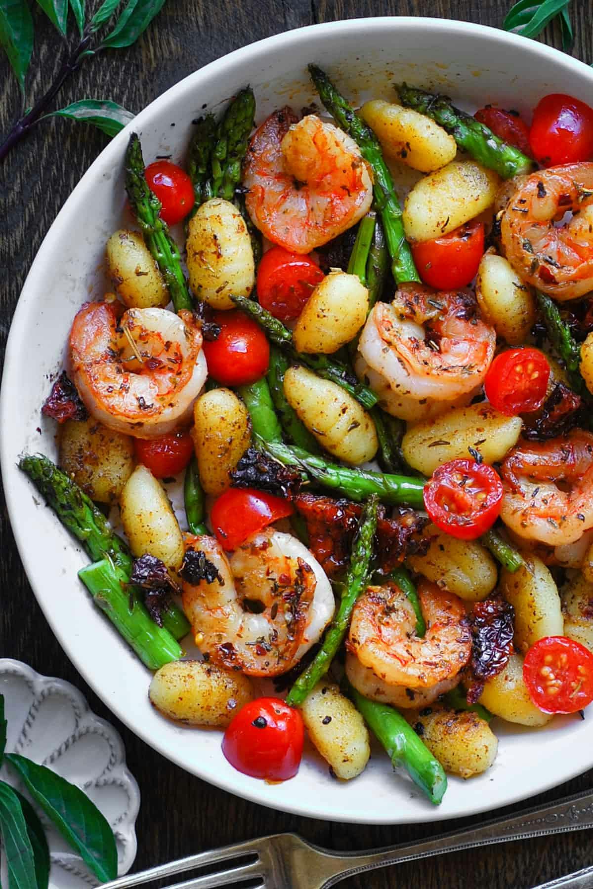 Shrimp and Crispy Gnocchi with Asparagus, Cherry Tomatoes, and Sun-Dried Tomatoes