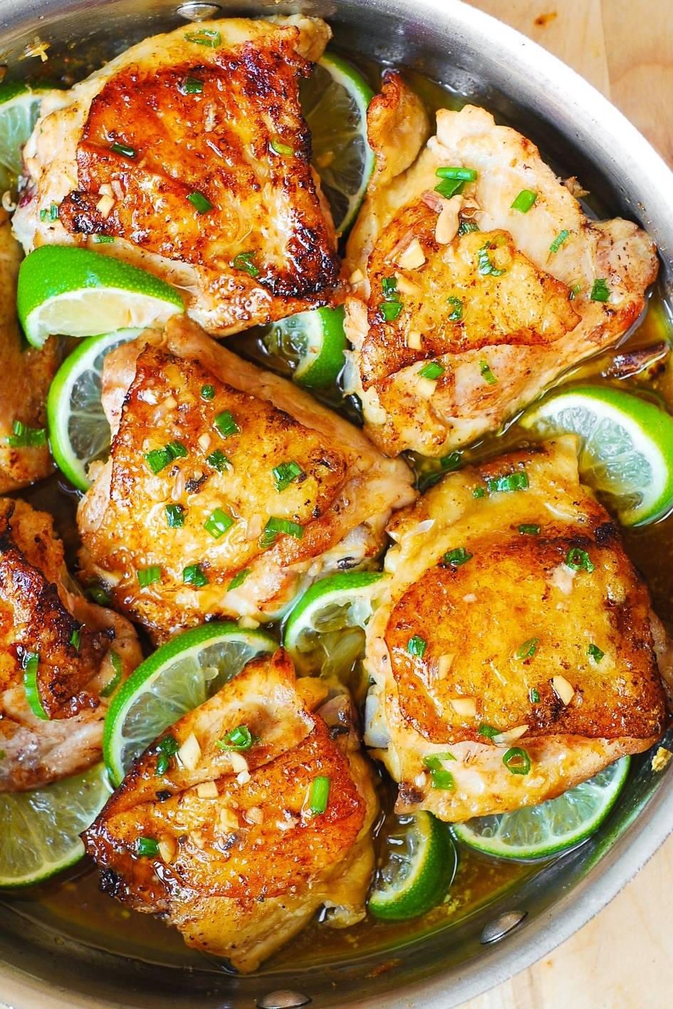 Honey Lime Chicken Thighs in a stainless steel pan.