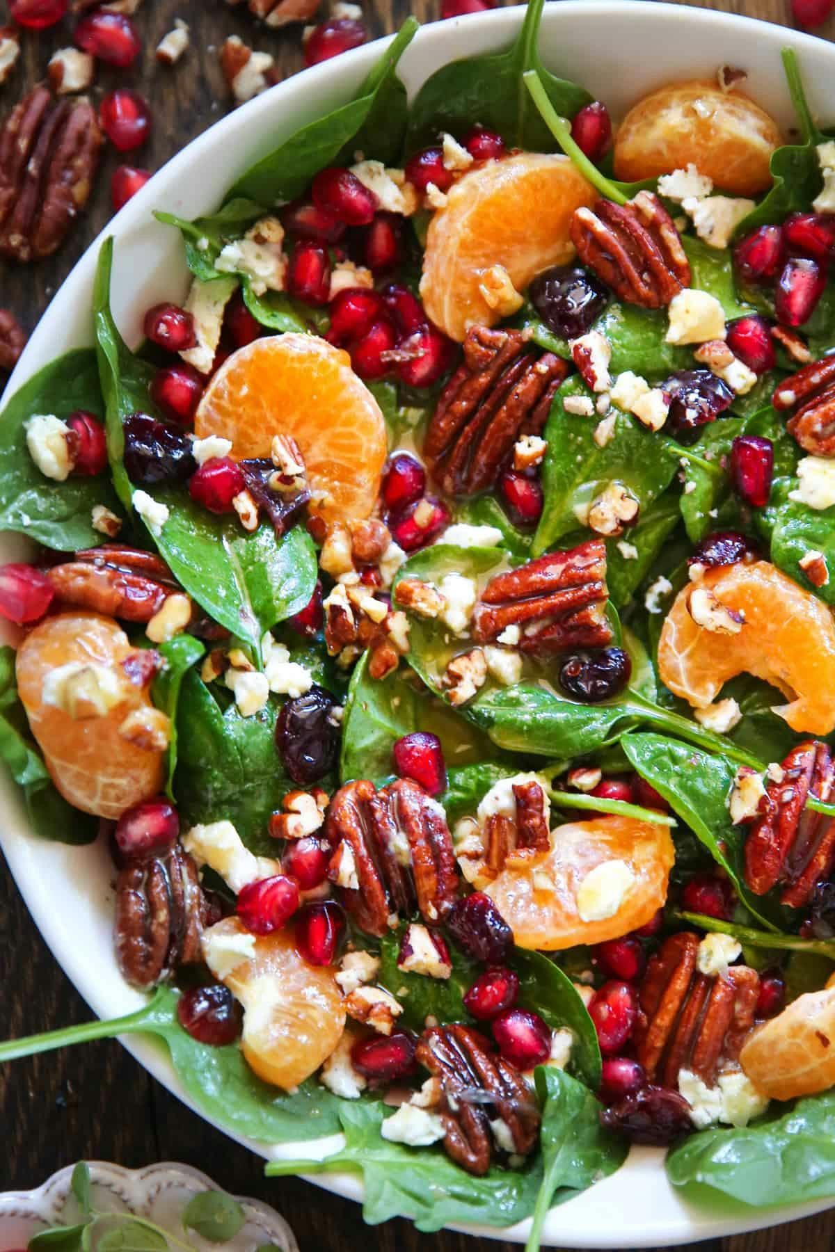 Holiday Salad with Spinach, Mandarins, Dried Cranberries, Goat Cheese, Pomegranate, and Honey-Mustard Lime Vinaigrette