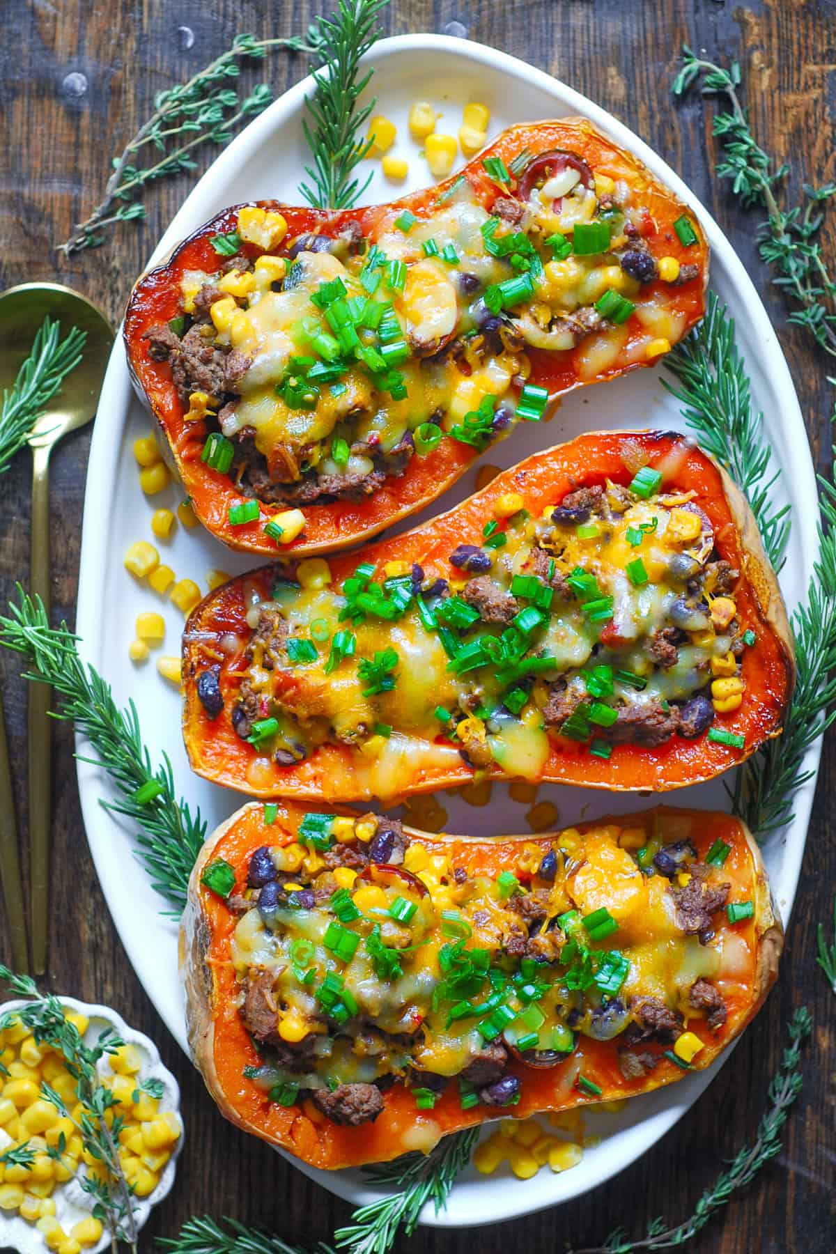 Southwestern Ground Beef Stuffed Butternut Squash (3 stuffed halves on a white platter).