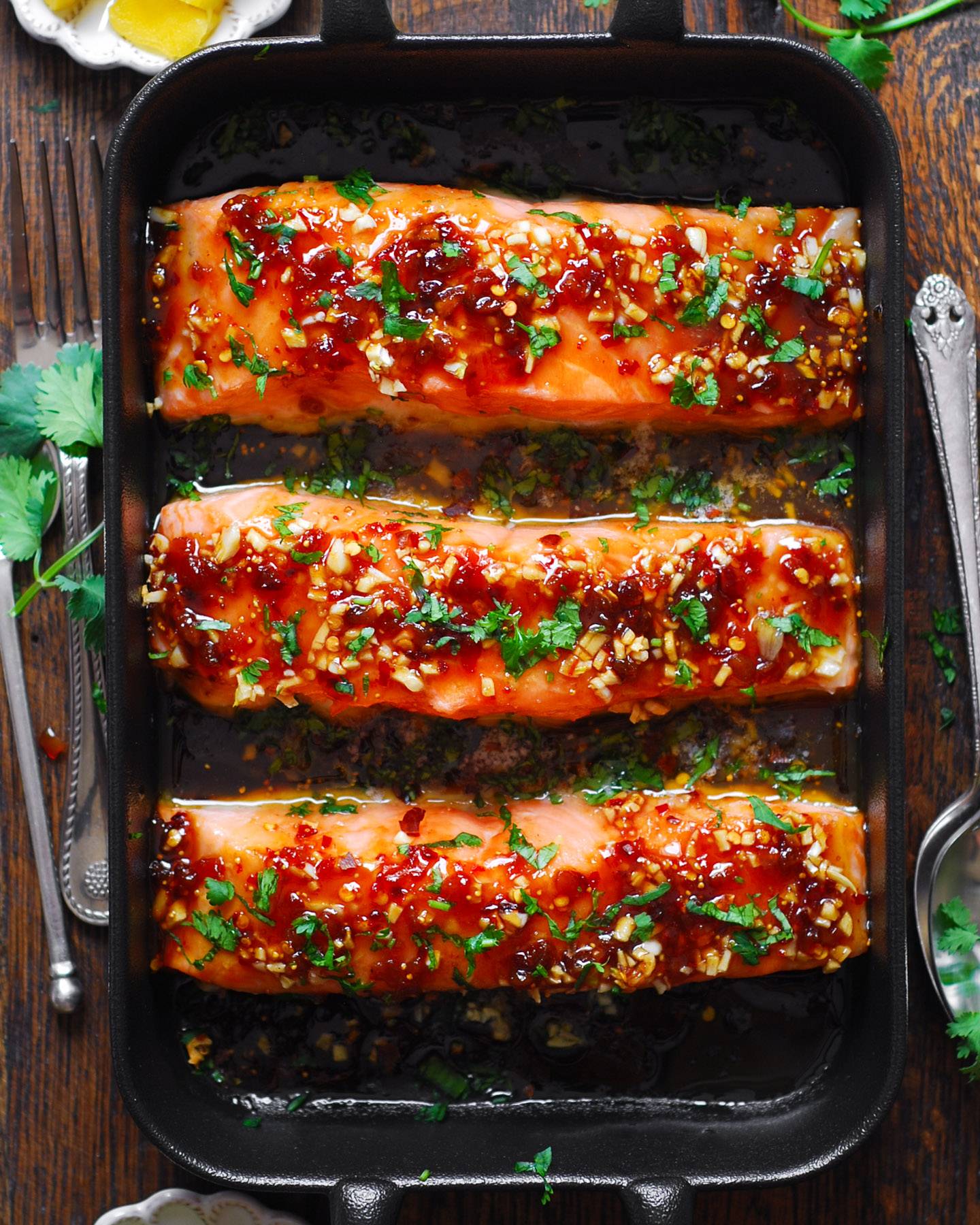 Honey Garlic Glazed Salmon with Fig Jam - in a black baking dish.