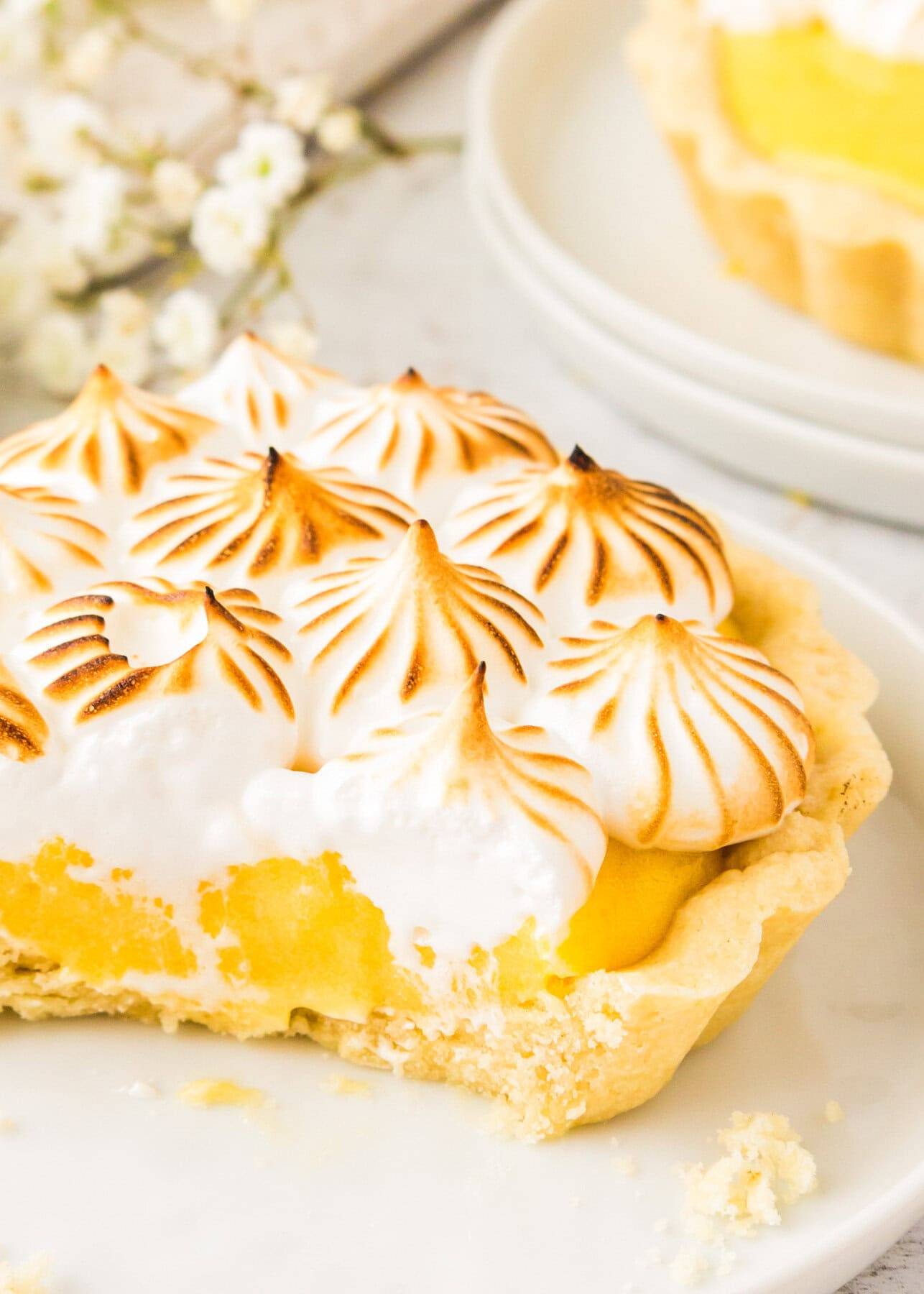 Lemon Meringue Tartlet on a plate.
