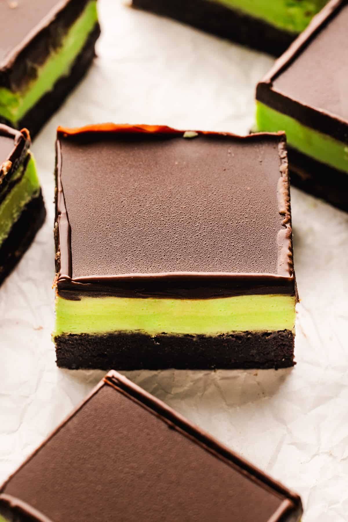 Mint Chocolate Brownies on a white surface.