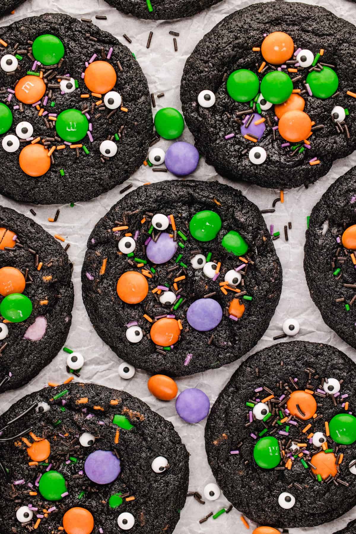 Monster cookies on a white parchment paper.
