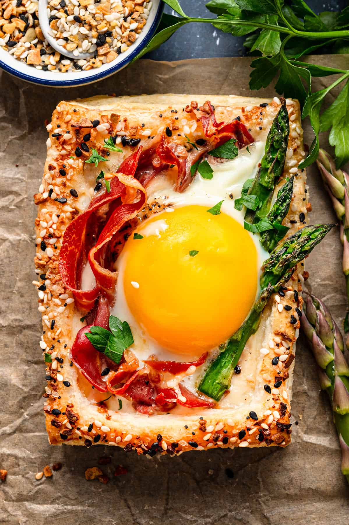 Puff pastry egg tart on parchment paper.