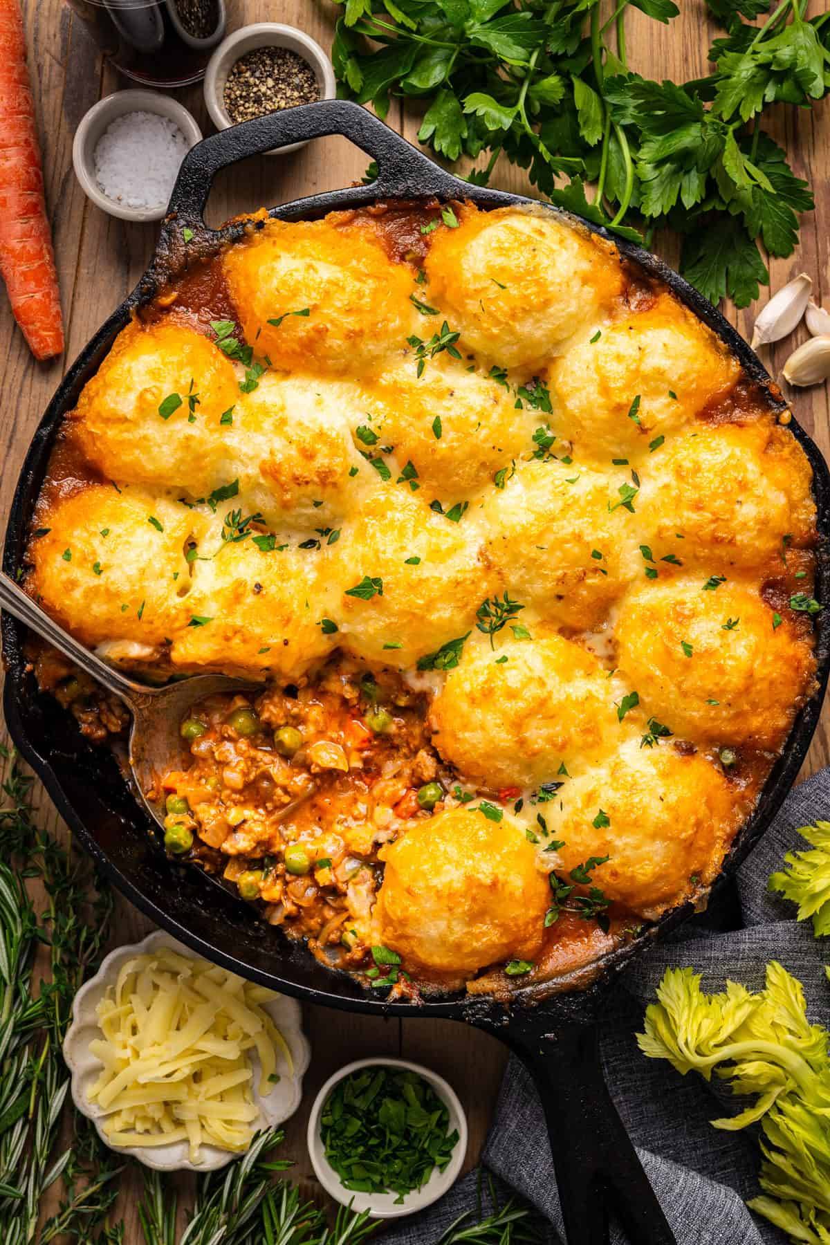 Shepherd's Pie made with ground beef (or lamb), topped with cheesy mashed potatoes, and baked in a cast-iron skillet until golden. 
