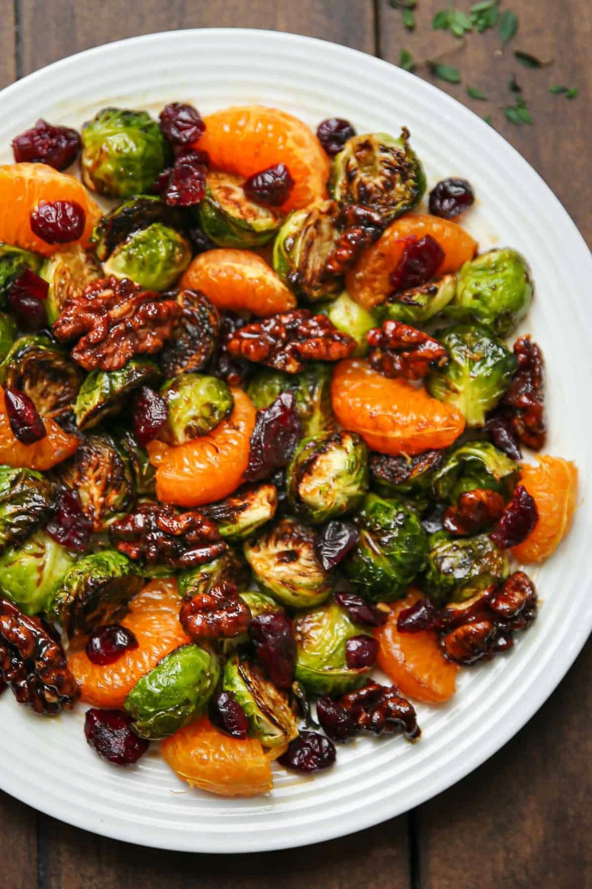 Roasted Brussels Sprouts with Mandarin Oranges, Walnuts, Cranberries, and Balsamic Glaze.