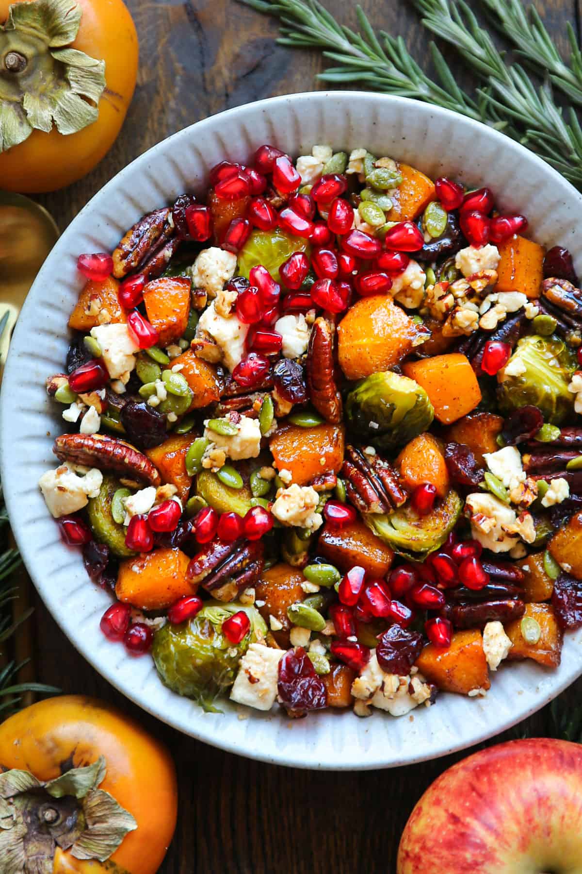 Roasted Fall Vegetables (Maple-Cinnamon Butternut Squash and Brussels Sprouts) with Feta and Maple-Lime Dressing - in a white bowl.