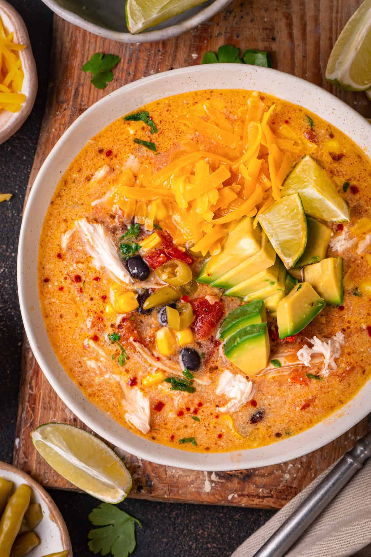 Creamy Chicken Enchilada Soup in a white bowl.