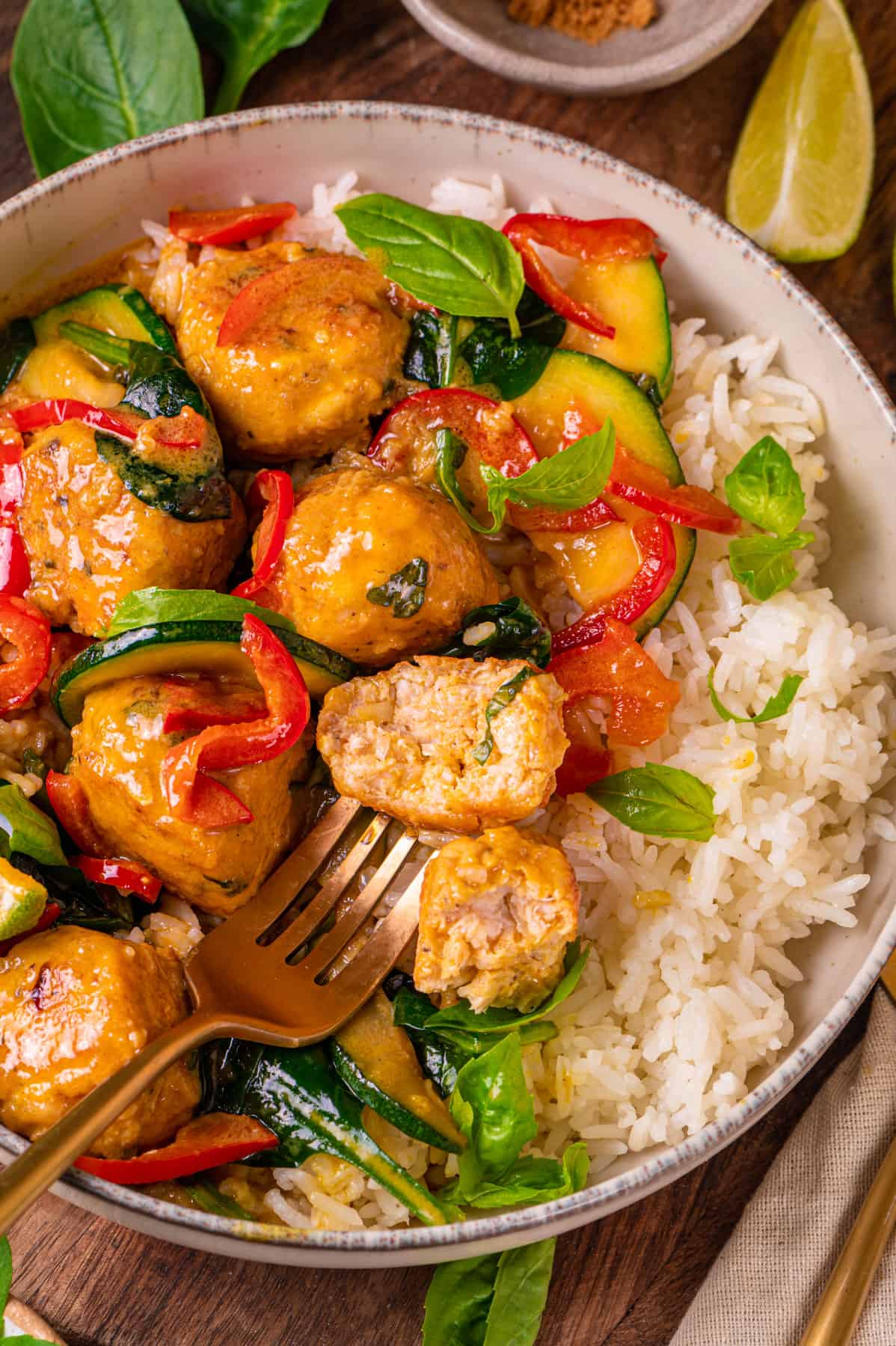 Thai Chicken Meatball Curry with rice in a bowl.