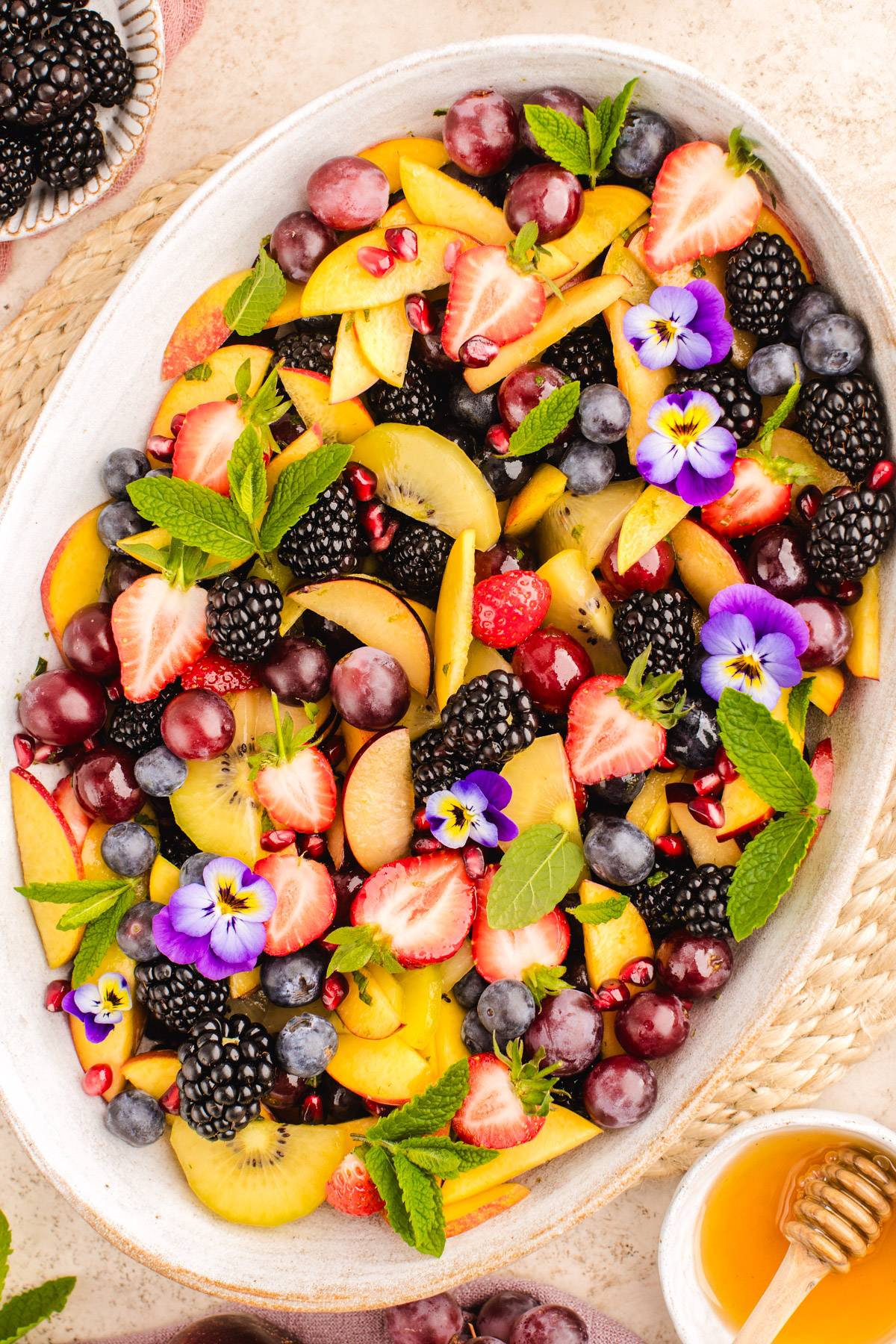 Summer Fruit Salad on a white platter.