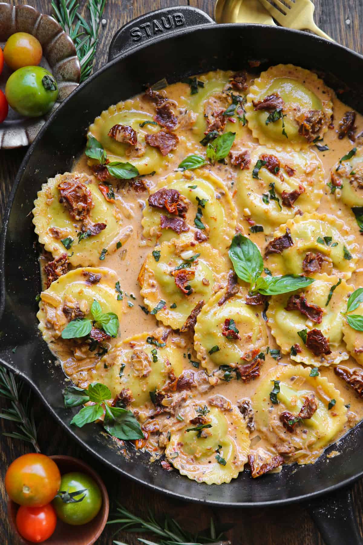 Marry-Me Ravioli with Sun-Dried Tomato Sauce in a cast iron skillet.
