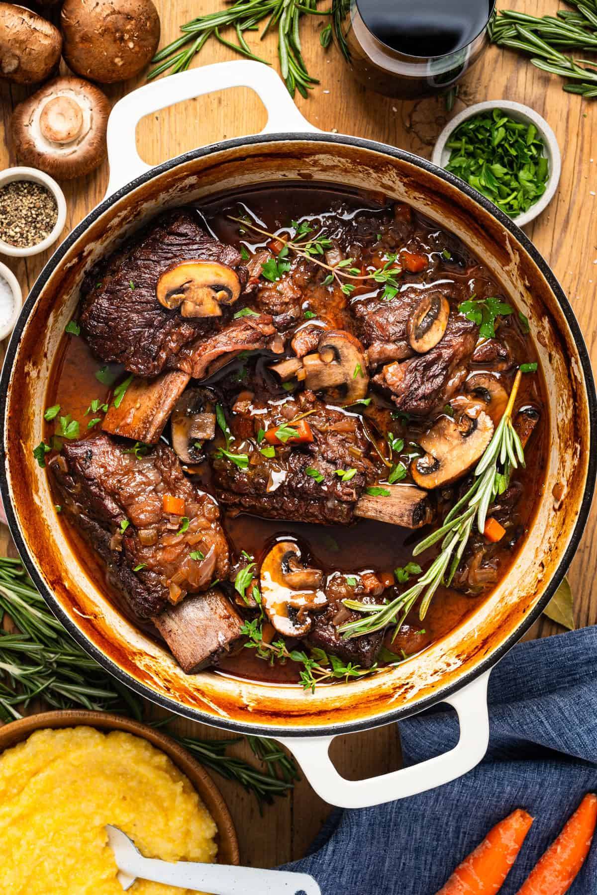 Braised Short Ribs with Red Wine and Mushrooms in a Dutch oven.