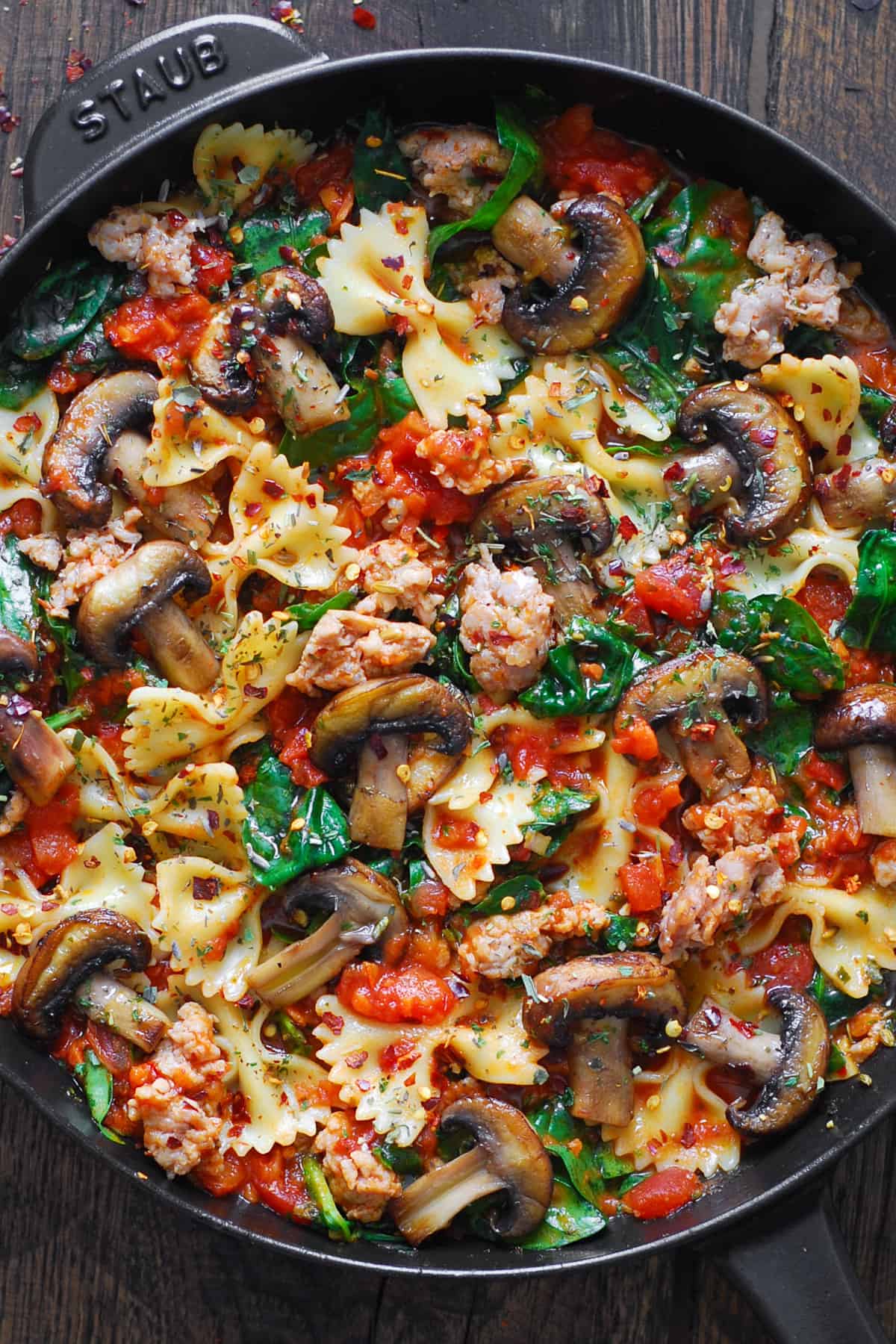 Italian Sausage Pasta (with Spinach, Mushrooms, and Marinara Sauce) in a cast iron skillet.
