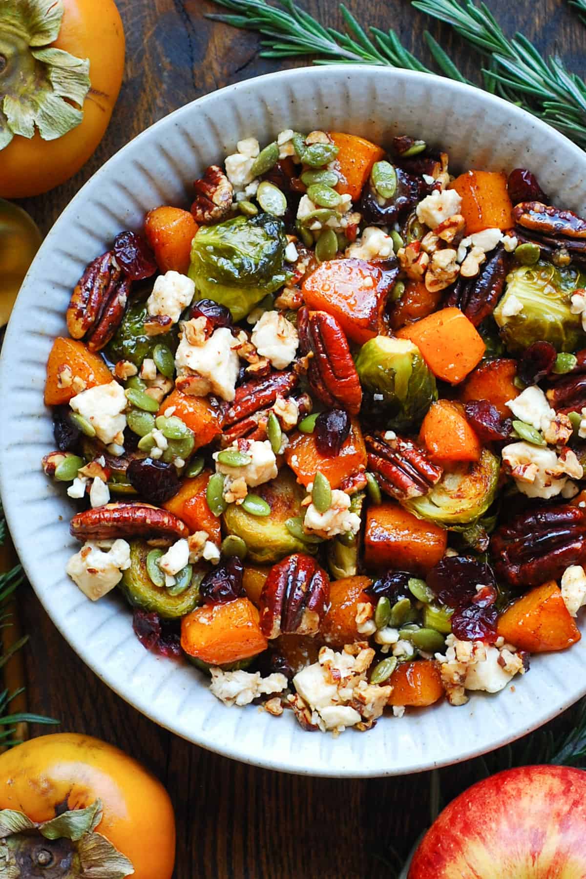 Roasted Fall Vegetables (Maple-Cinnamon Butternut Squash and Brussels Sprouts) with Feta and Maple-Lime Dressing - in a white bowl.