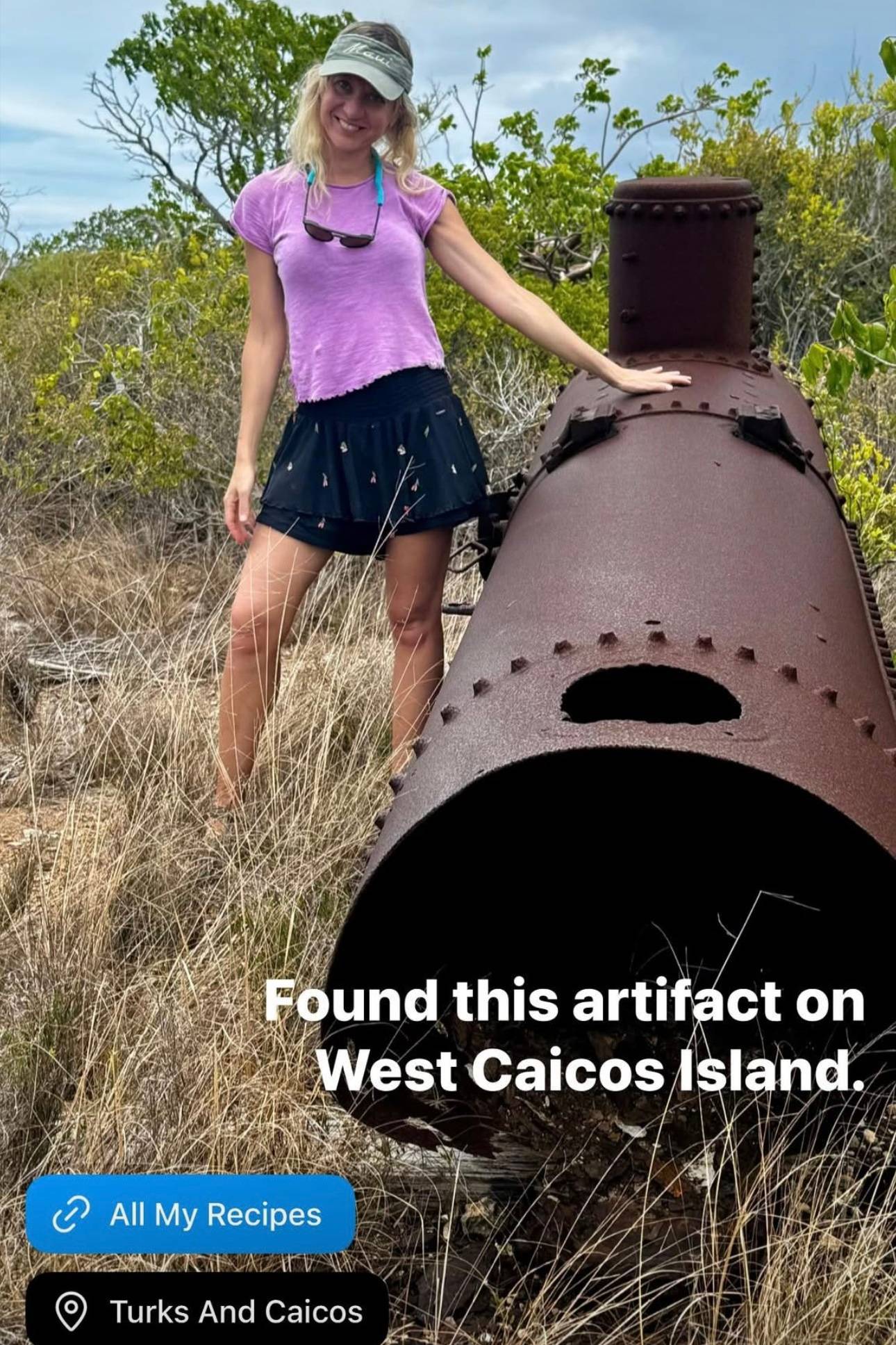 Julia with an old machinery artifact on an island.