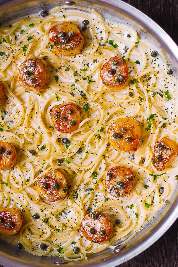 Scallop Spaghetti in Creamy White Wine Butter Garlic Sauce with Capers in a stainless steel skillet.