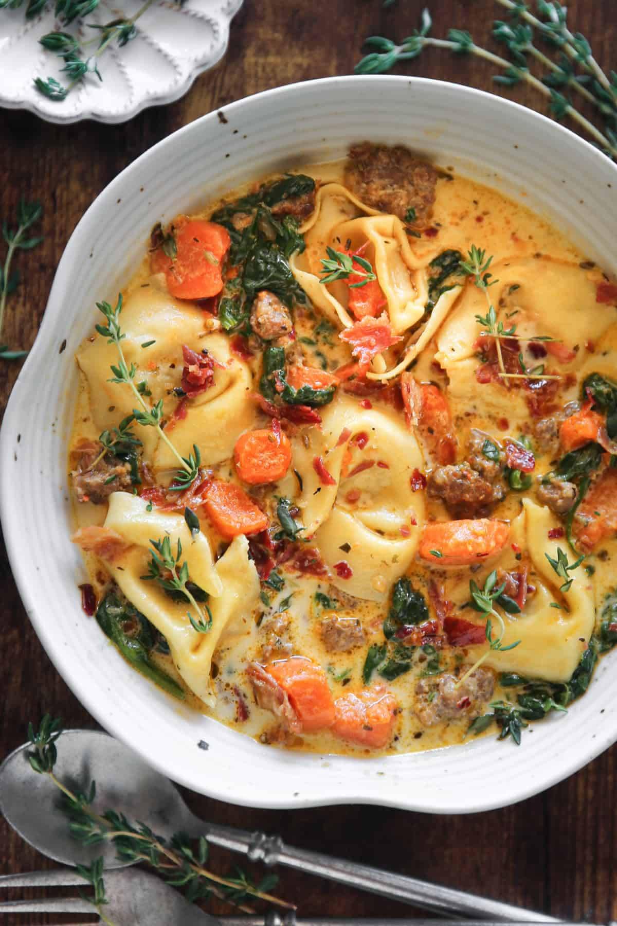 Creamy Italian Sausage Tortellini Soup with Spinach, Carrots, and Bacon Bits