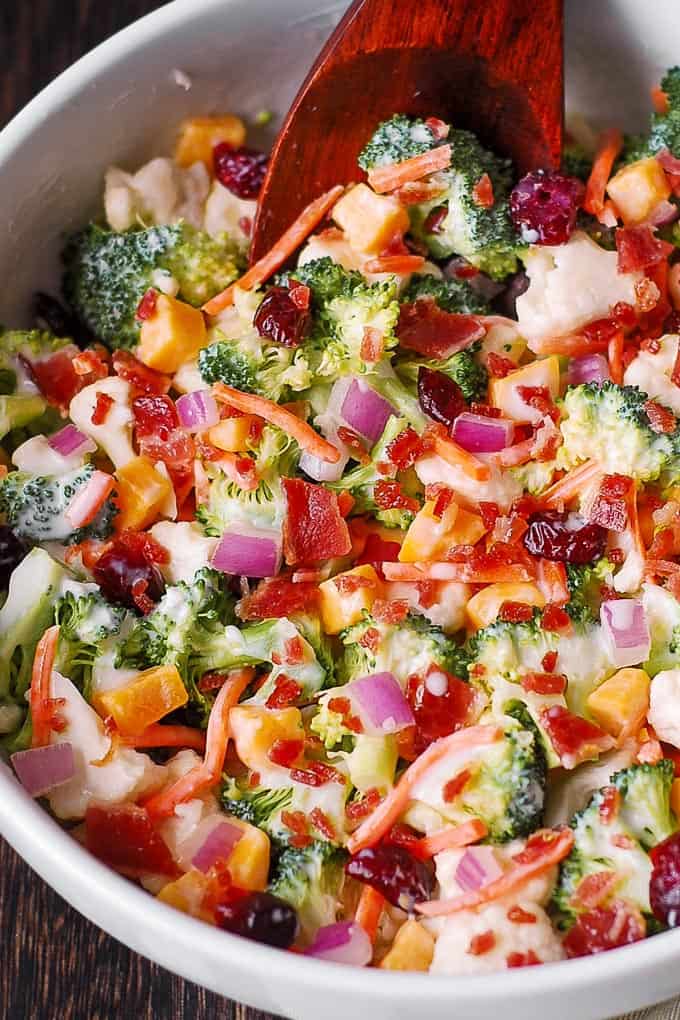 Creamy Broccoli and Cauliflower Salad with Cheddar Cheese, Bacon, Cranberries, Carrots, Red Onions​.