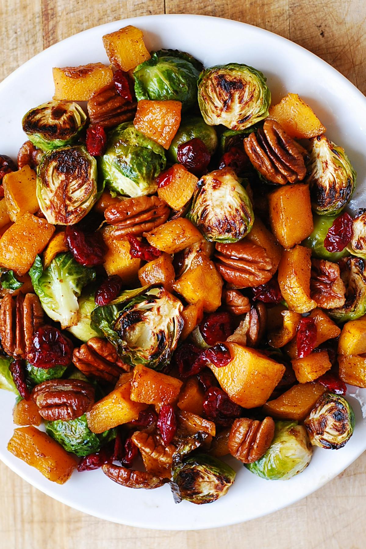 Roasted Brussels Sprouts and Cinnamon Butternut Squash with Pecans and Cranberries.