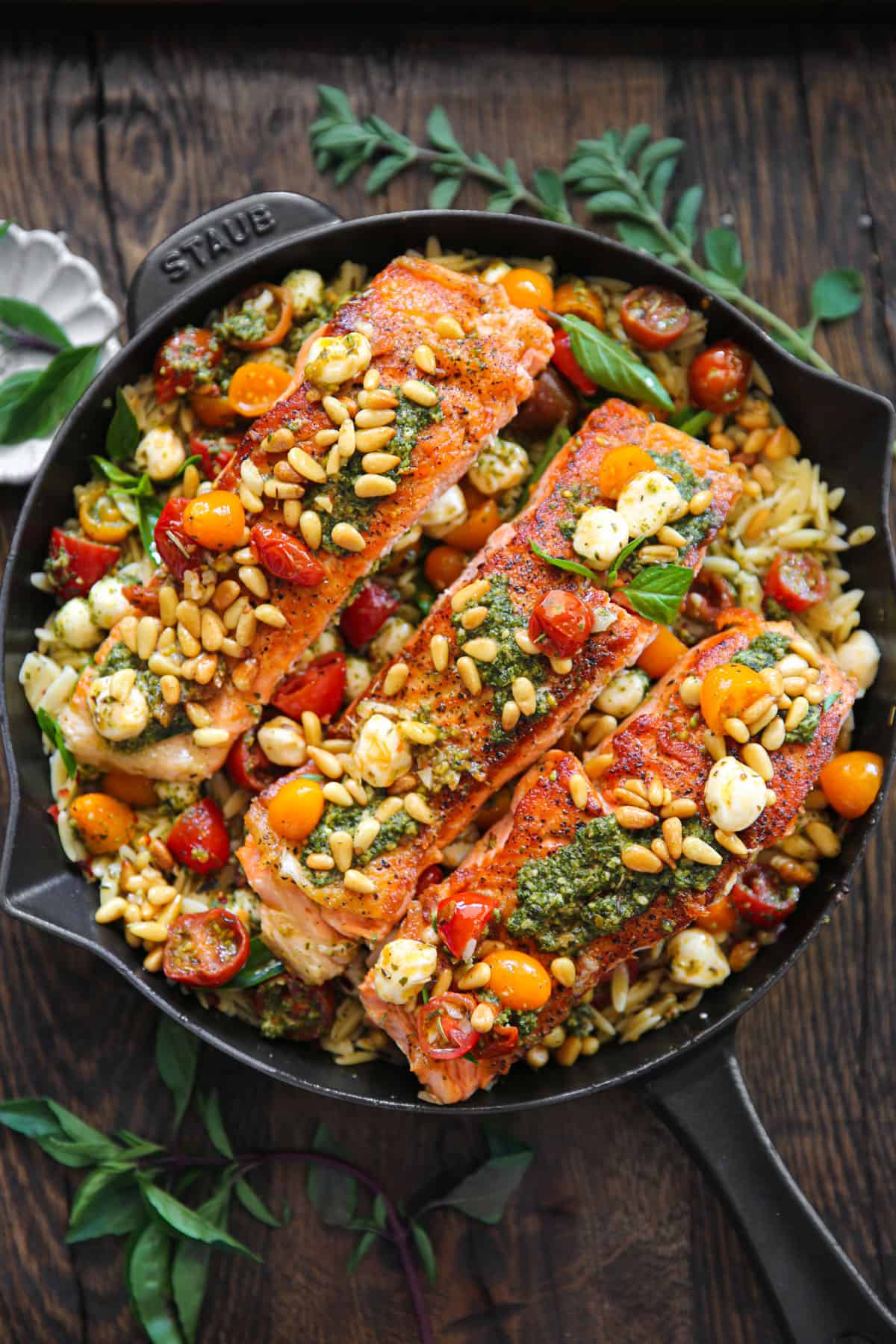 Mediterranean Salmon Orzo in a cast iron skillet.