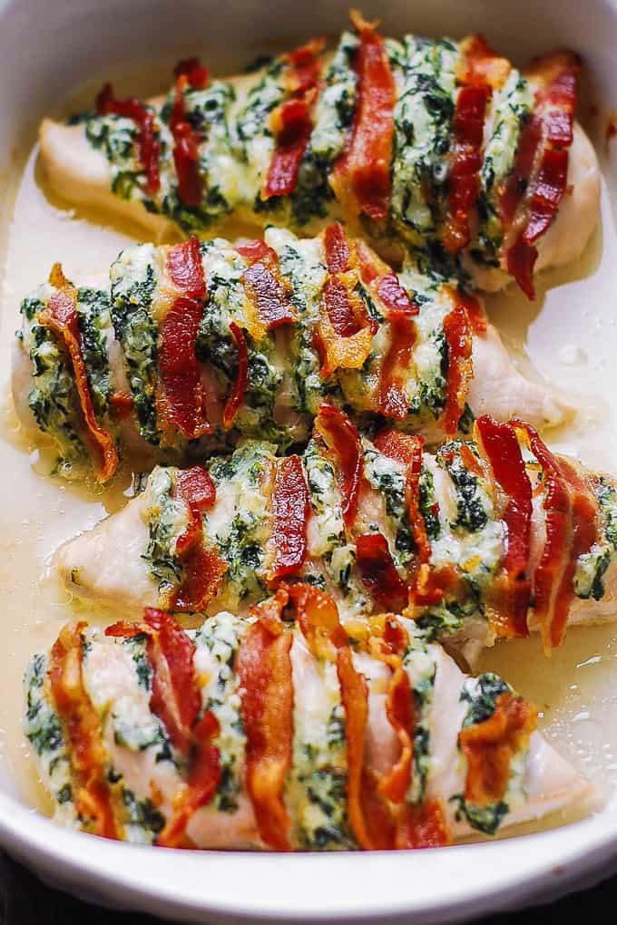 Hasselback Chicken is stuffed with Spinach, Parmesan, Mozzarella, Cream Cheese, and Bacon 