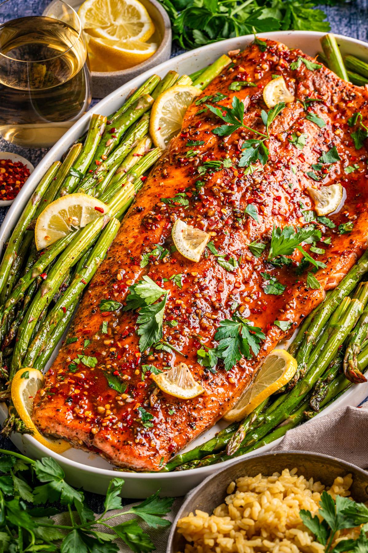 Sheet-Pan Maple Glazed Salmon with Roasted Asparagus on a white platter.