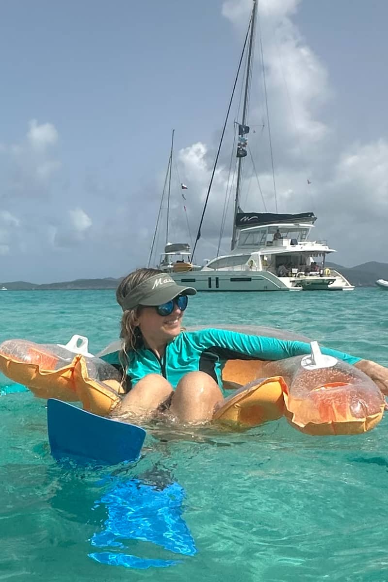 Julia in an inflatable floatie in the ocean.