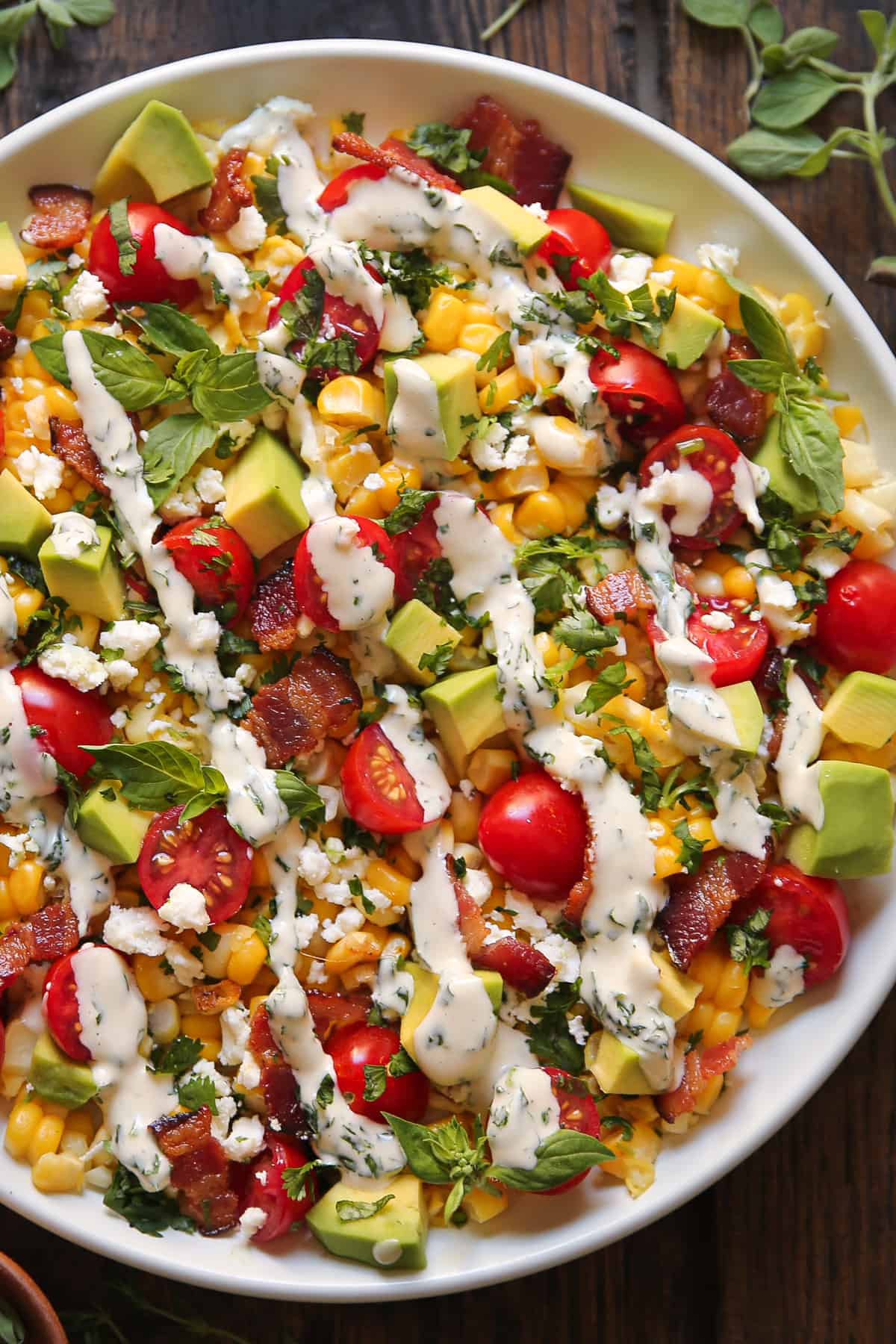 Avocado Corn Tomato Salad with Creamy Cilantro-Lime Dressing on a plate.