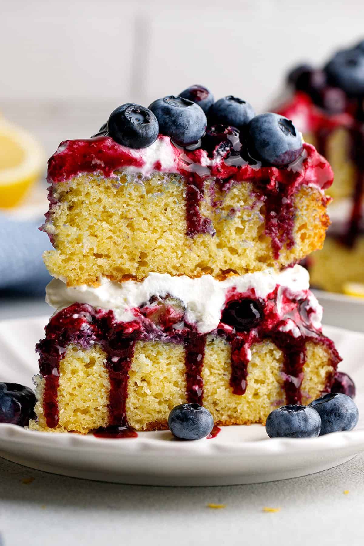 A slice of blueberry shortcake cake on a plate.