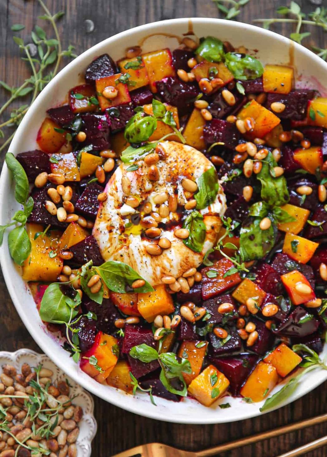 Beet and Burrata Salad with Pine Nuts and Balsamic Dressing in a bowl.